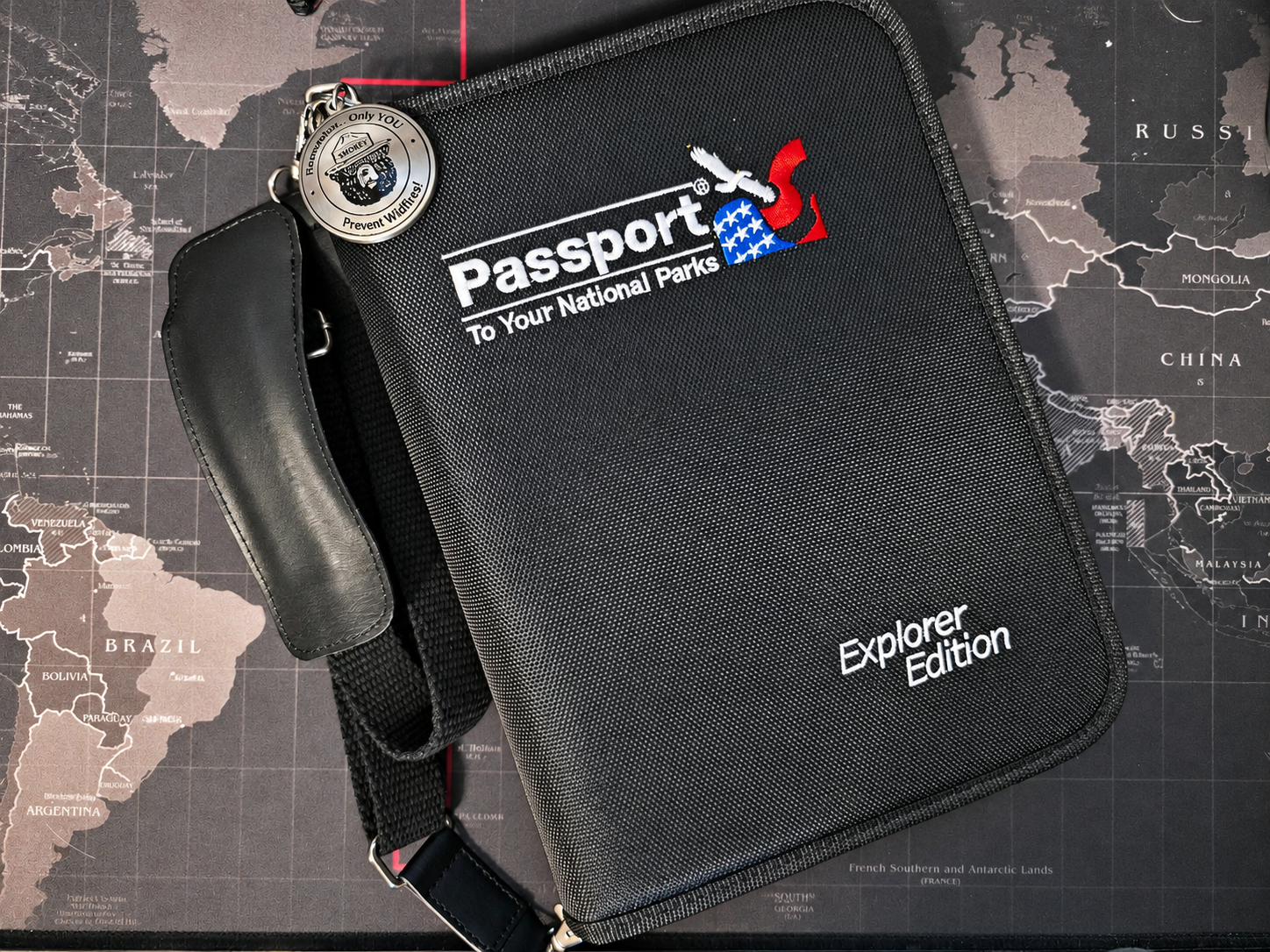 National Parks Passport Explorer Edition travel binder with Smokey Bear keychain