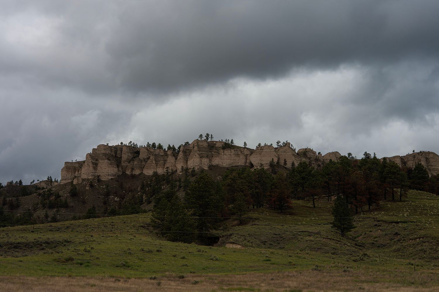 Storm clouds over the rugged landscape near Fort Robinson State Park in western Nebraska