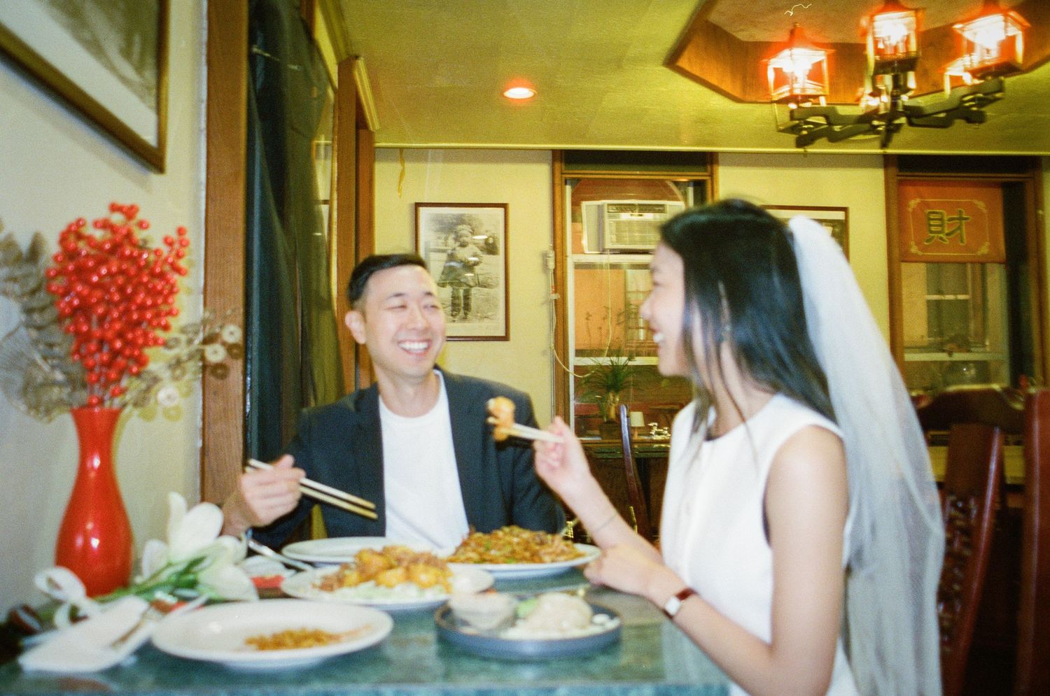 A series of connected photos showing a casual dining experience with people gathered around a table at a restaurant.