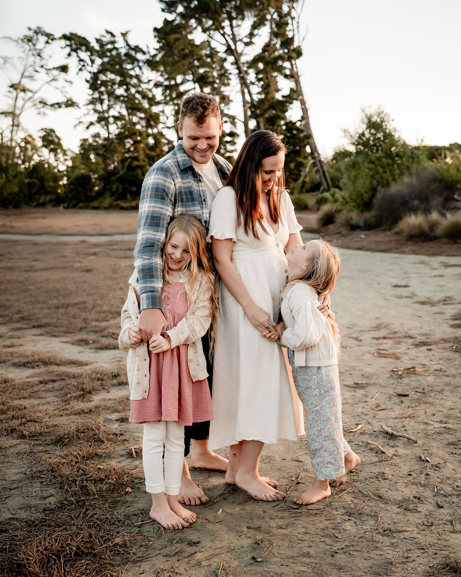 Parents embracing their children during family session