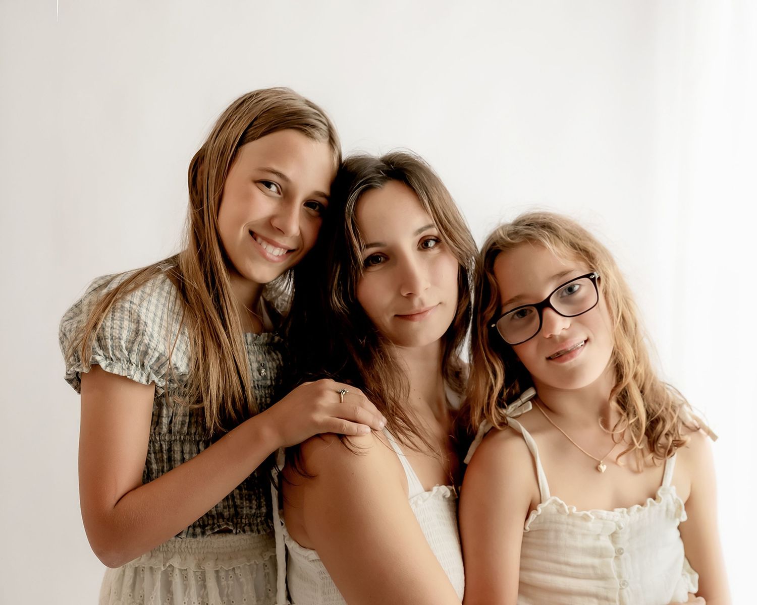 mother posing with her children in a studio mothers day portrait session in Nelson
