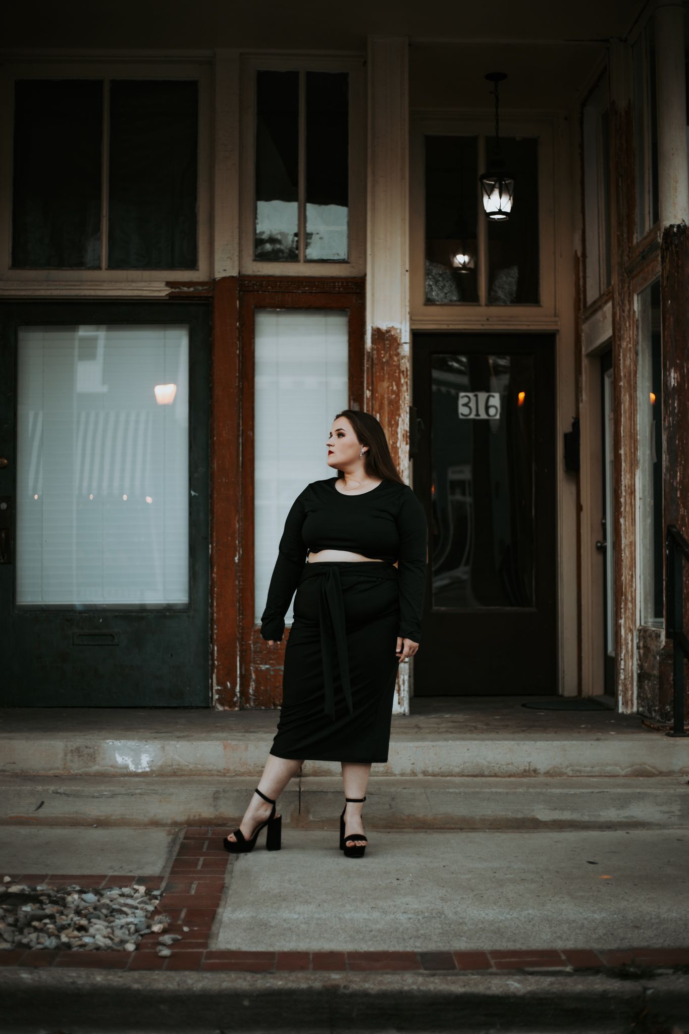 Plus size model poses in urban setting portrait shoot