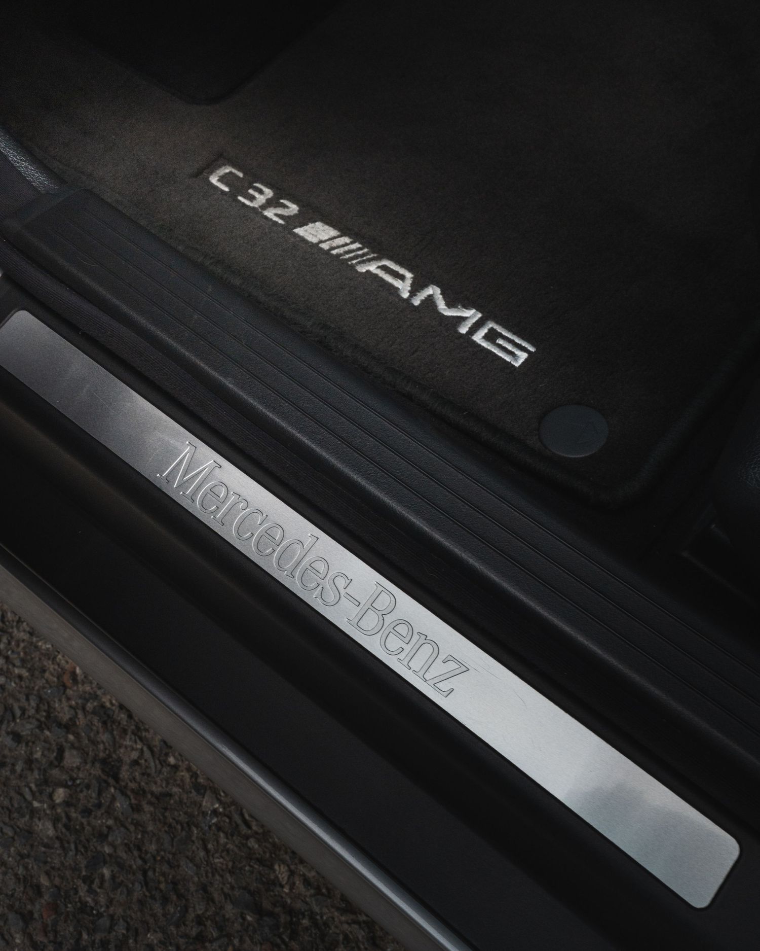 The driver's door sill and carpet, of the C32 AMG sedan.