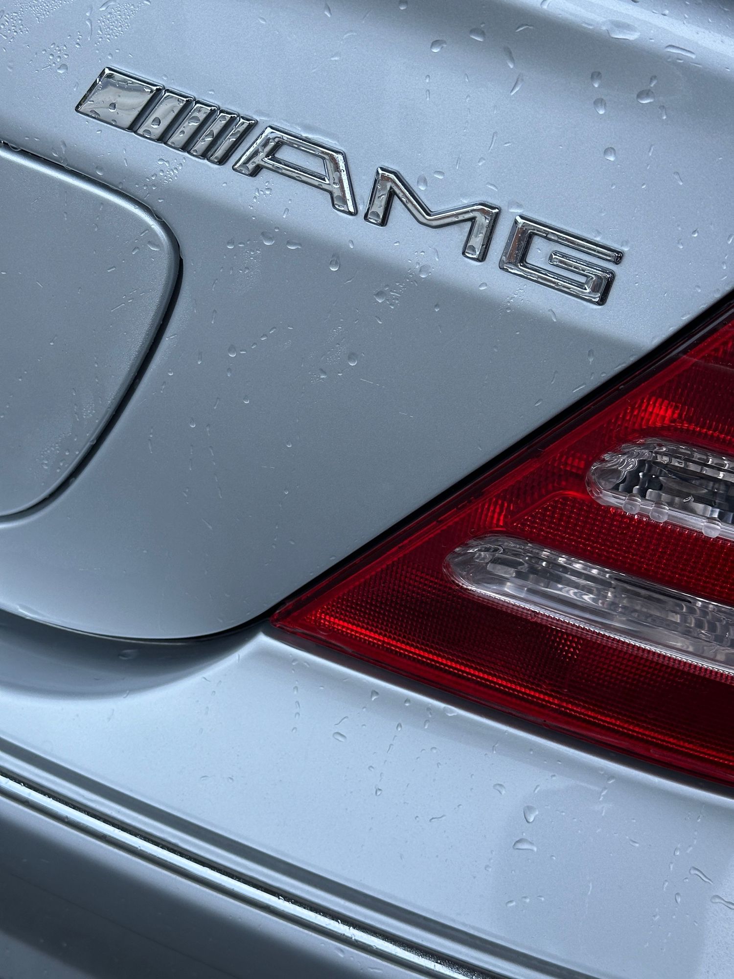 The AMG logo on the C32 sedan.
