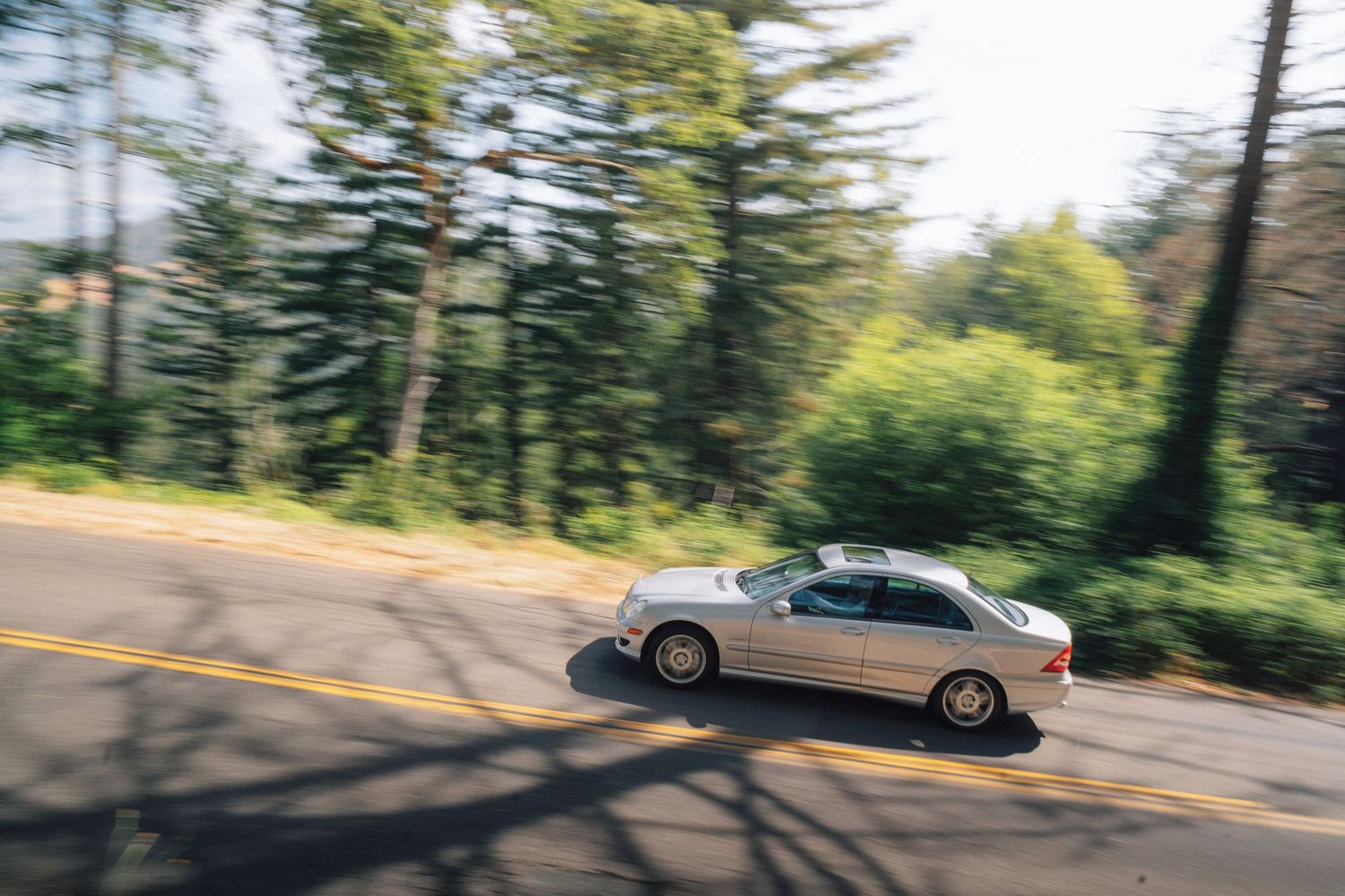 C32 AMG at Breakfast Club Rally, winding through a forest in the hills of St. Helena, CA.