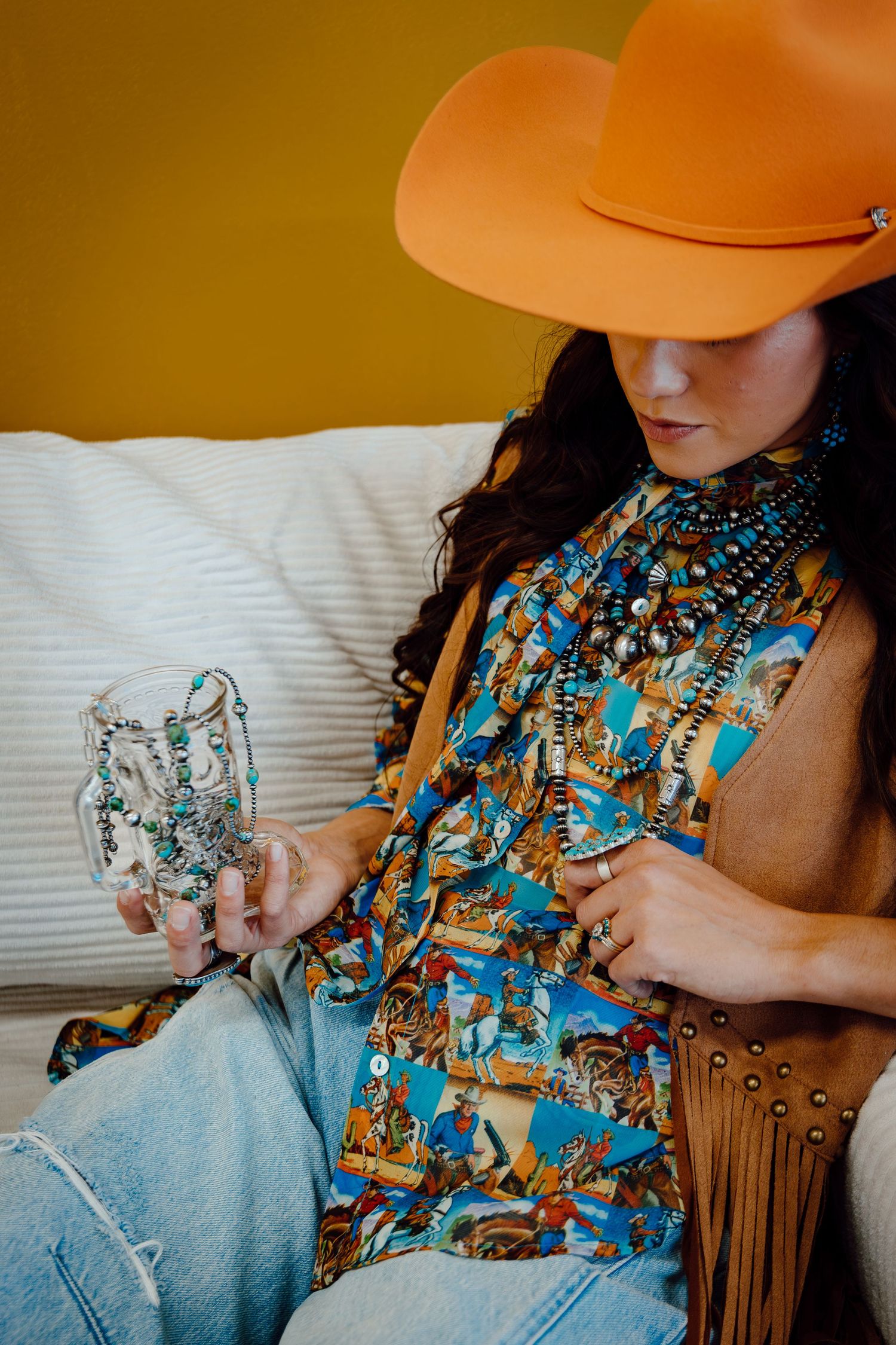A North Platte, Nebraska lifestyle brand session close-up of a western style outfit featuring turquoise jewelry and denim details.