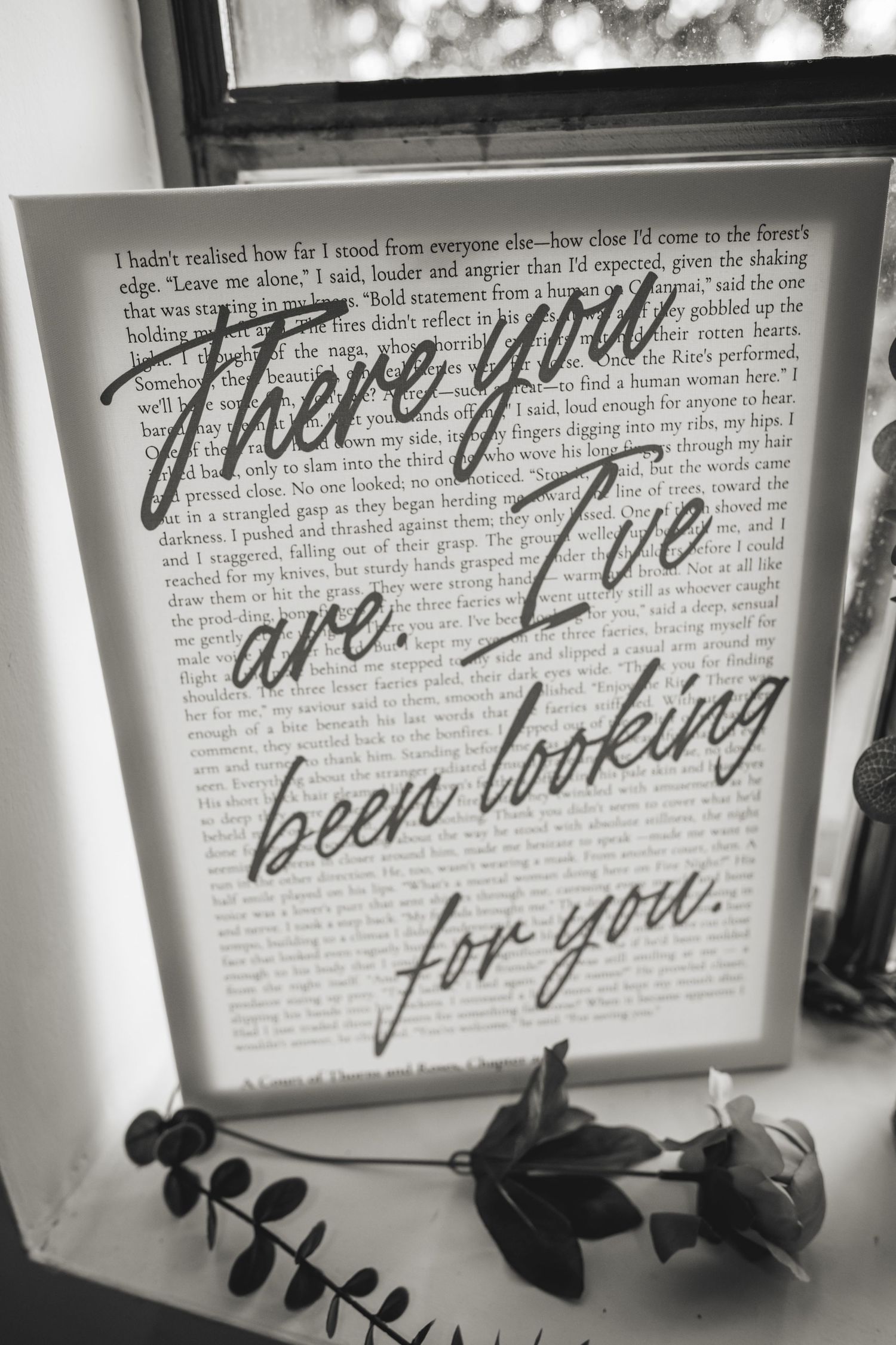 Framed black and white book page art with cursive text reading There you are, I've been looking for you.