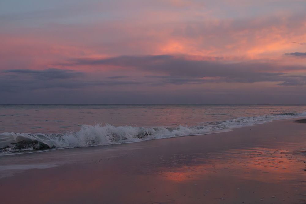South Florida beach sunset with waves and pink sky