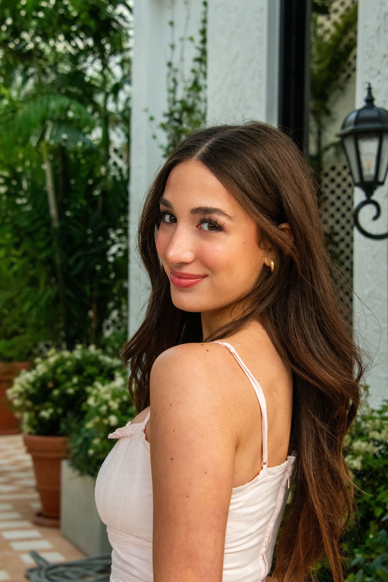 Palm Beach Gardens senior portrait with tropical greenery