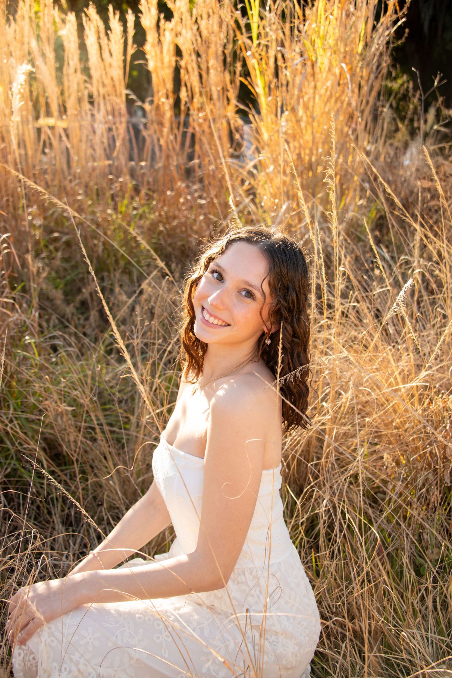 Palm Beach Gardens senior portrait in tall grass natural light