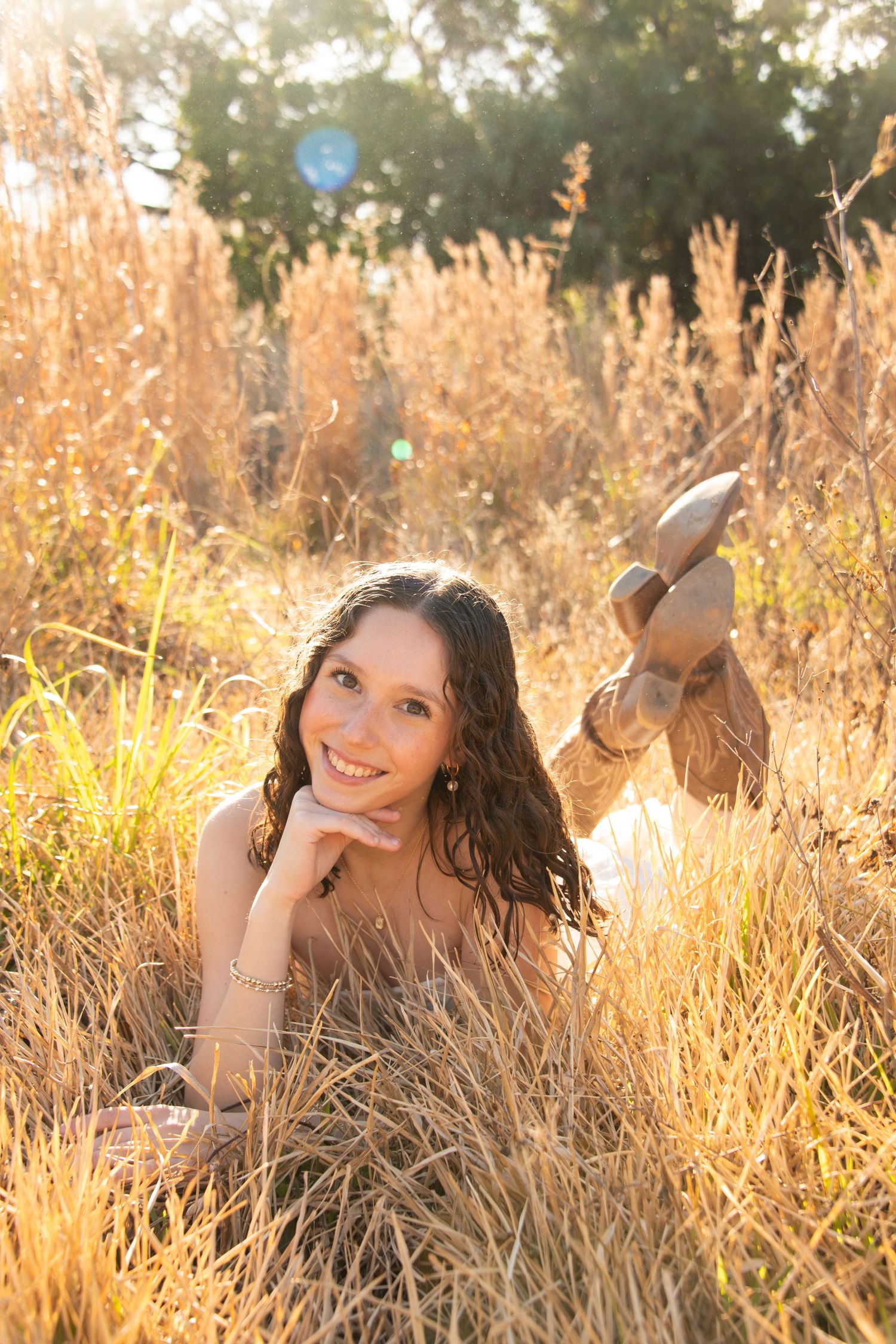 A series of outdoor portraits in golden sunlit tall grass during sunset creating a warm, dreamy atmosphere.