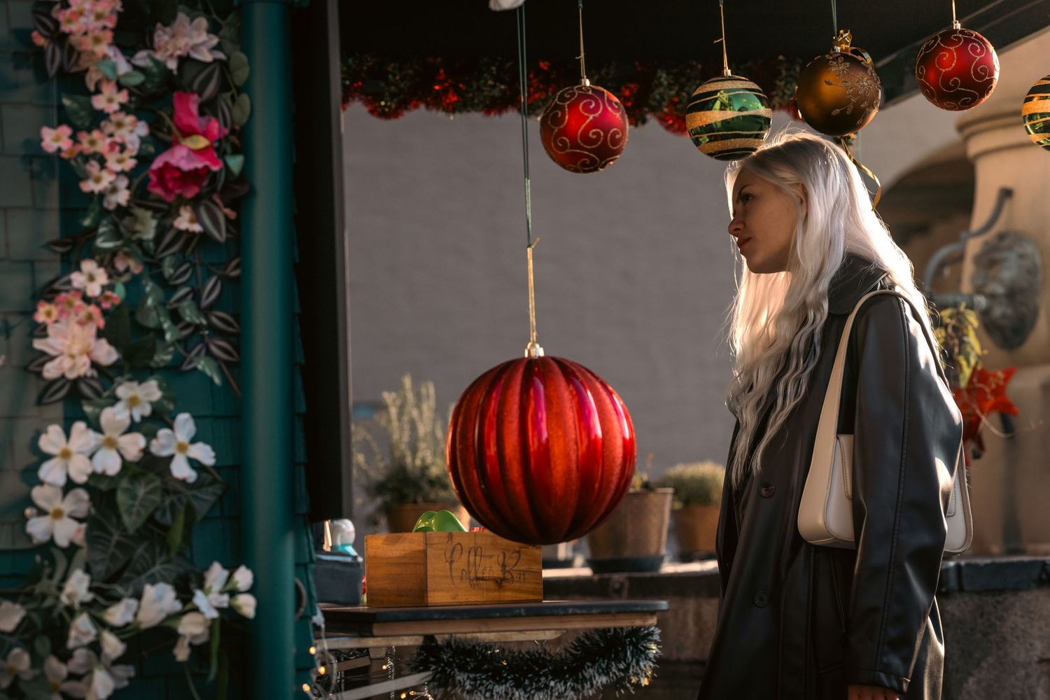 Traditional red lanterns and cherry blossoms decorate an atmospheric Asian restaurant interior.