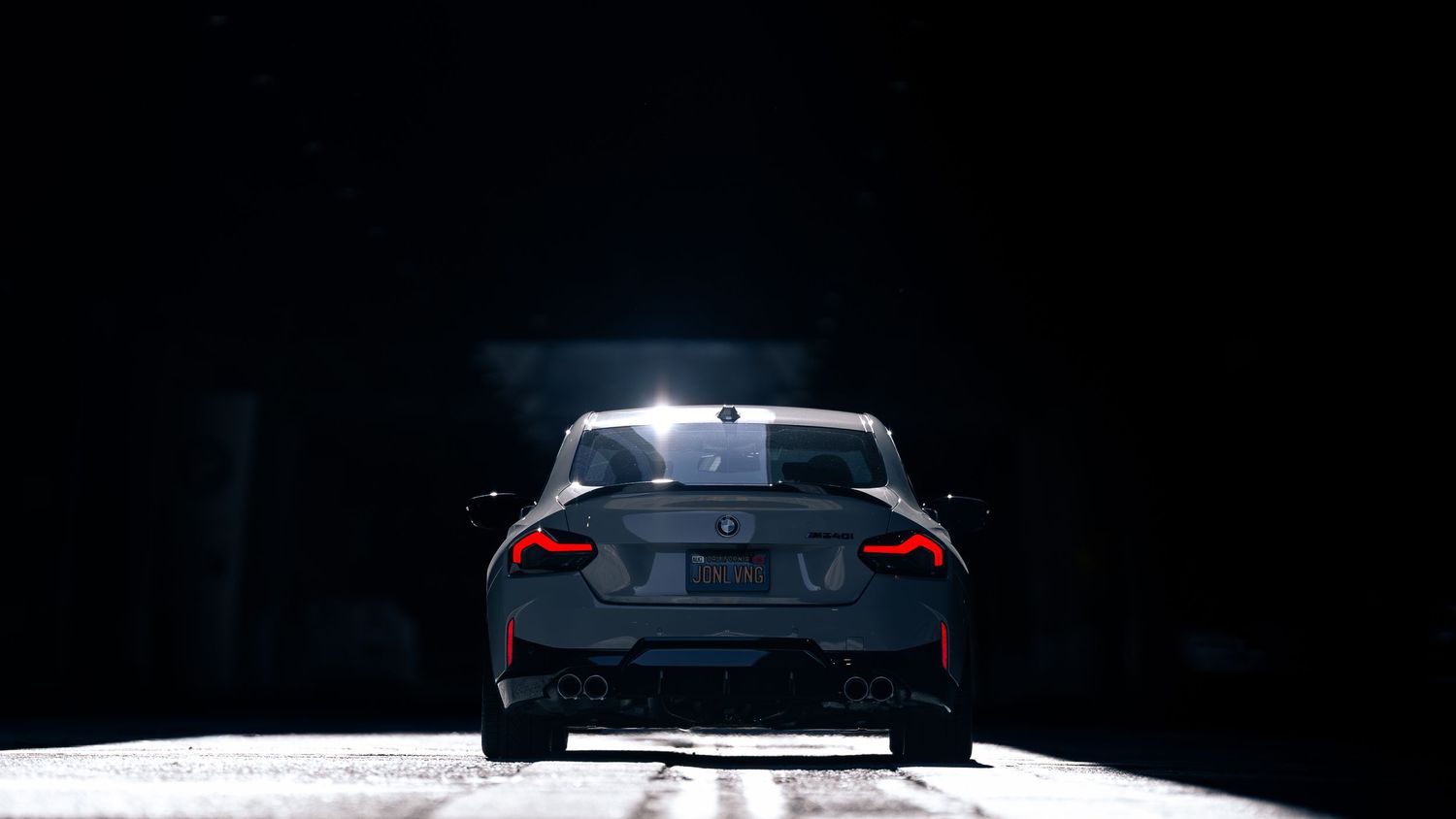 Close-up detail shots of a white BMW M car's exterior design elements and bodywork.