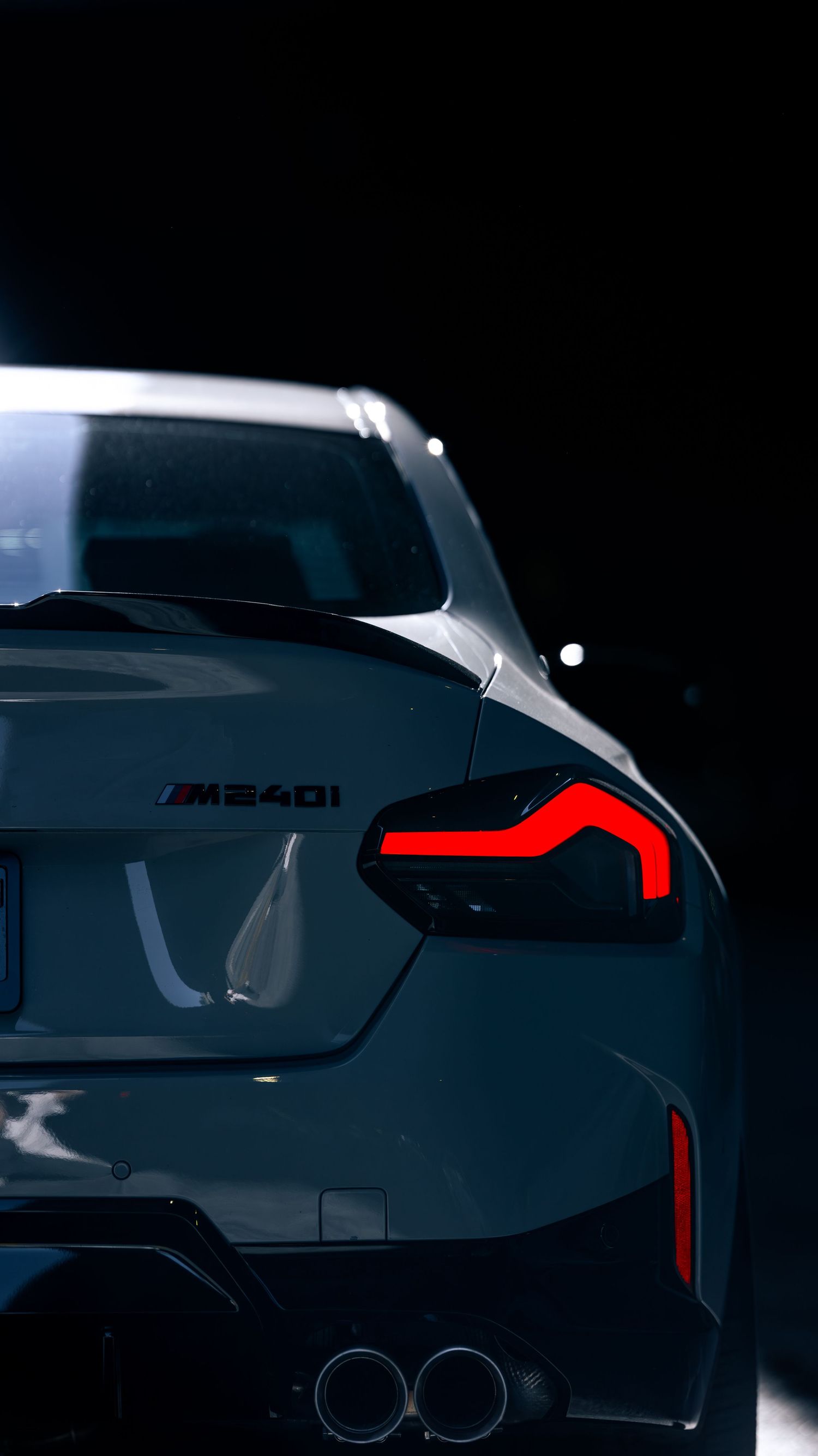 Artistic silhouette shots of a BMW M car's profile in low light conditions.