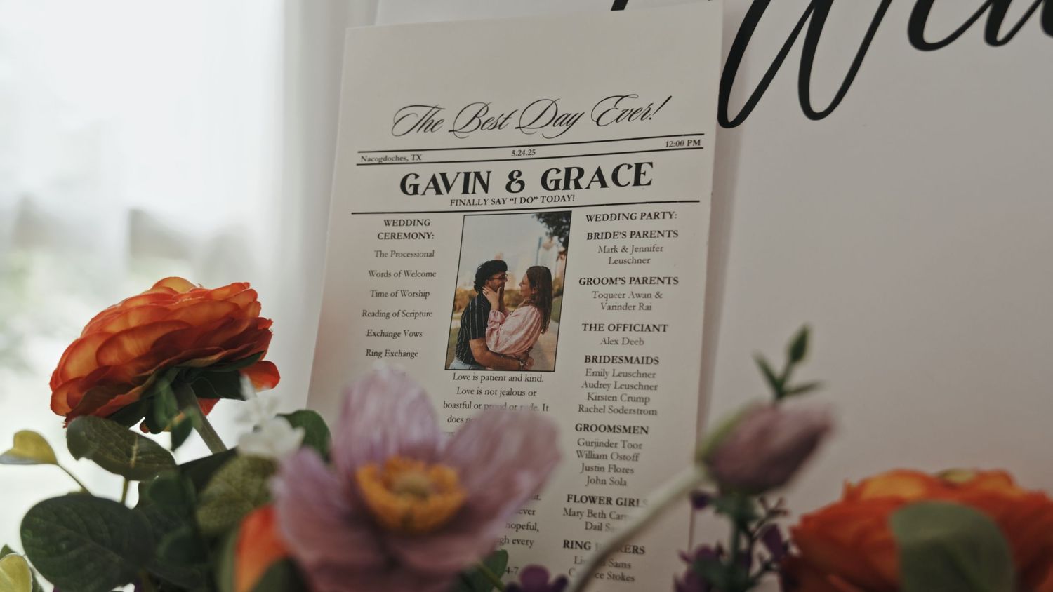 Close-up of elegant wedding program or menu with decorative text and floral elements.