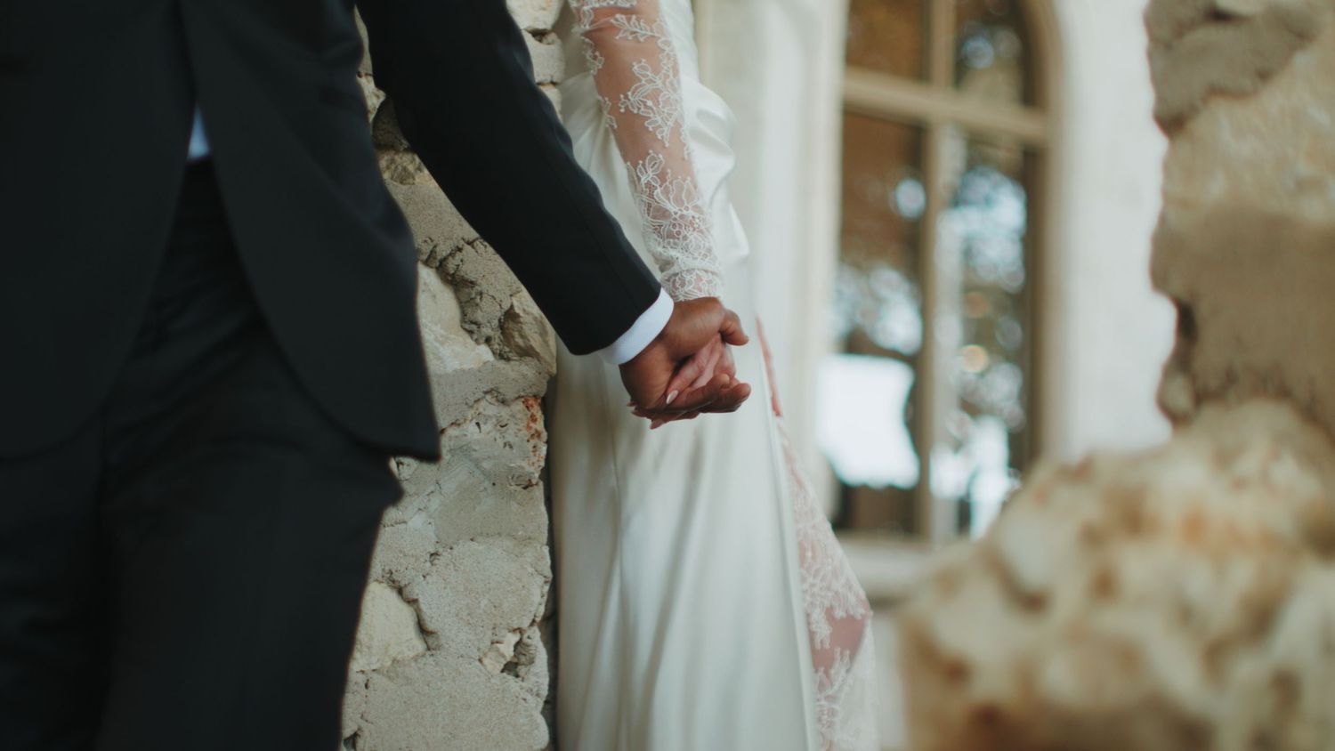Elegant wedding attire details captured in black and white photography.