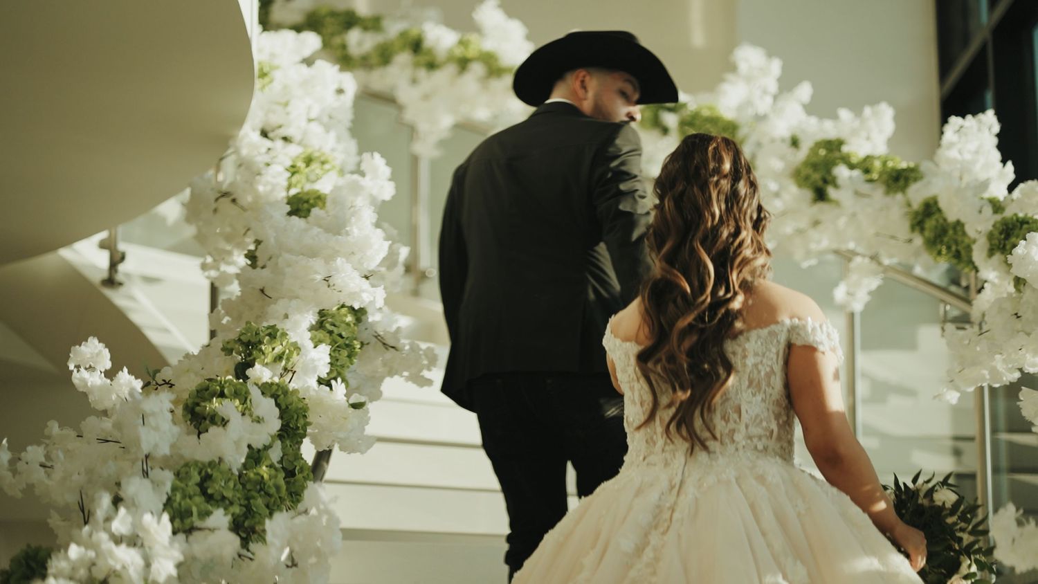 Elegant wedding decor featuring white floral arrangements and romantic lighting.