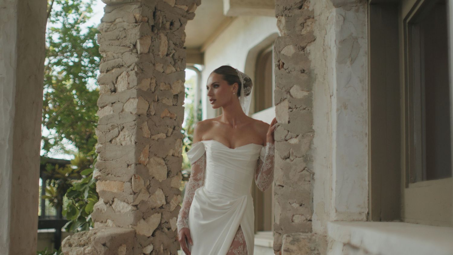 Stone pillars and archways create a romantic outdoor wedding setting.