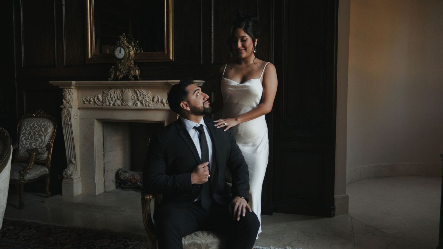 Intimate indoor venue with dramatic dark walls and elegant lighting design.