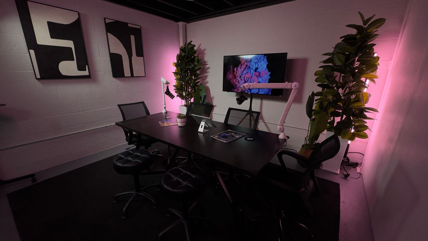 Professional podcast setup in Miami with table layout, microphones, and clean environment for interviews and content.