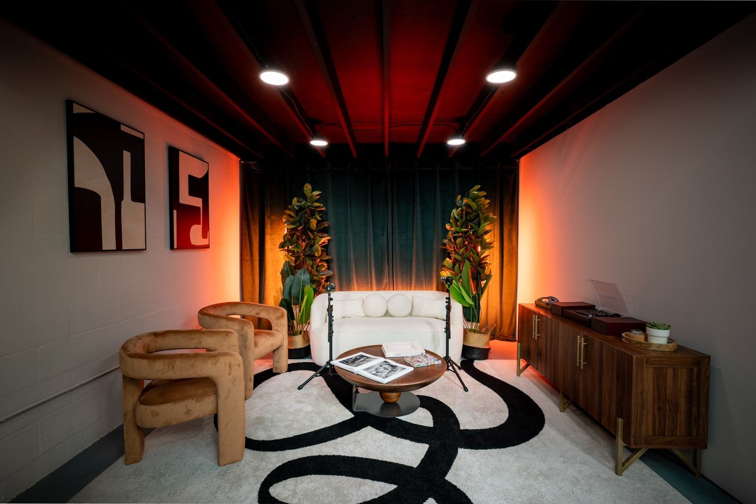 Podcast studio in Miami with lounge seating and ambient lighting, perfect for interviews and video content at Wykam Studio.