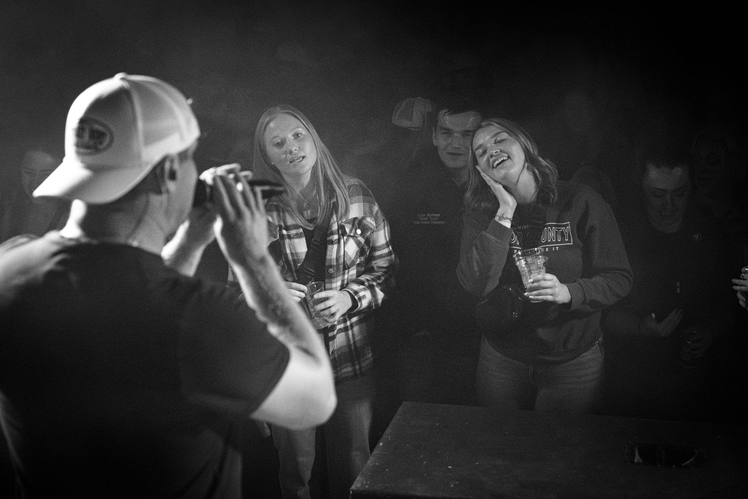 Dramatic black and white shots of concert attendees enjoying a performance. Nashville Pipeline Spooks on Spurr