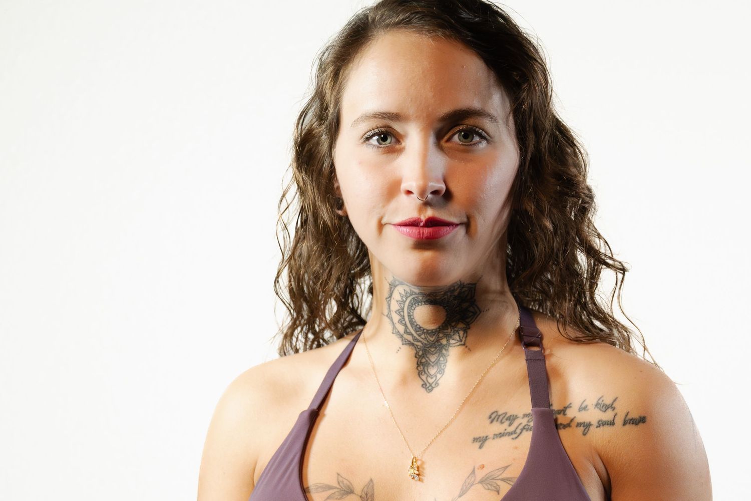 Portrait series against white background showing different poses and expressions. workout bra boudoir pose.