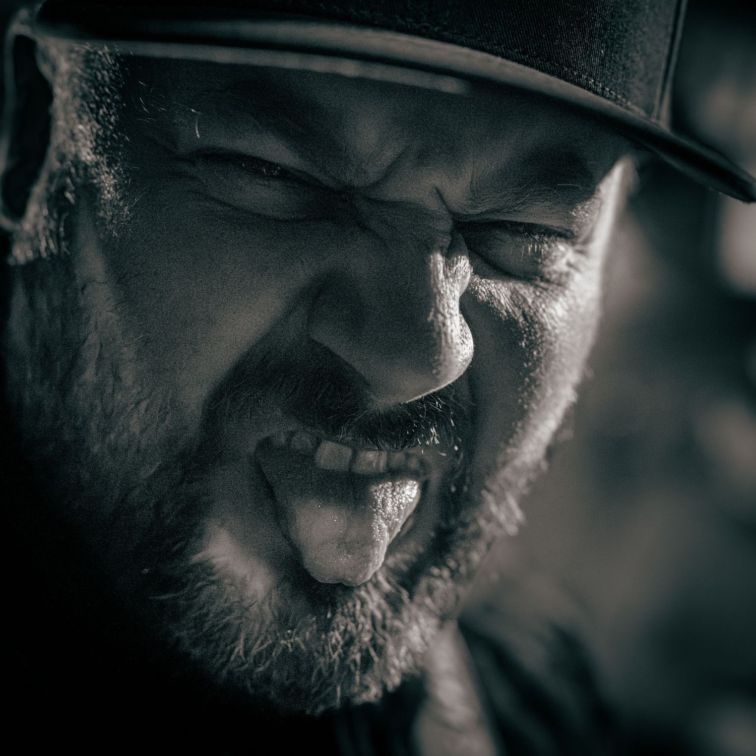 Close-up black and white portrait showing facial features in dramatic lighting. Grand Union.