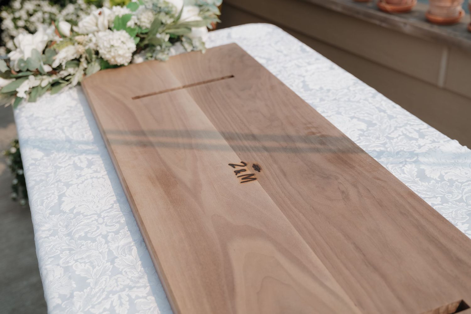 A woodworking project shows the progression of cutting and shaping a walnut slab into a finished piece of furniture.