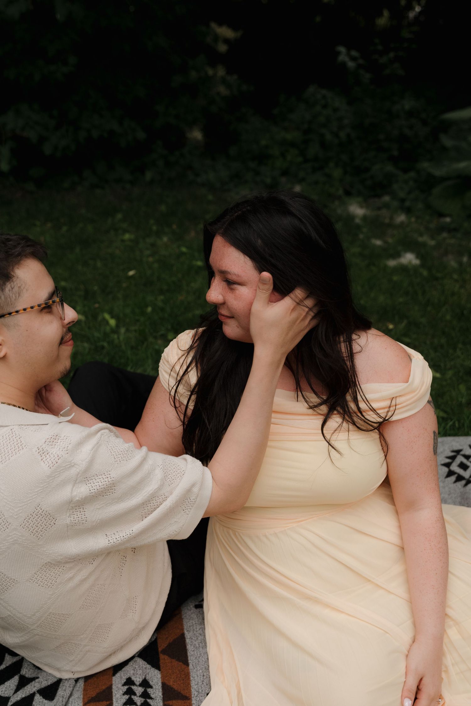 A couple shares playful moments and laughter in a series of casual outdoor portraits.
