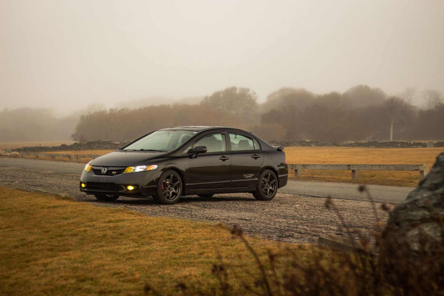 Black 2010 Honda civic SI Foggy day