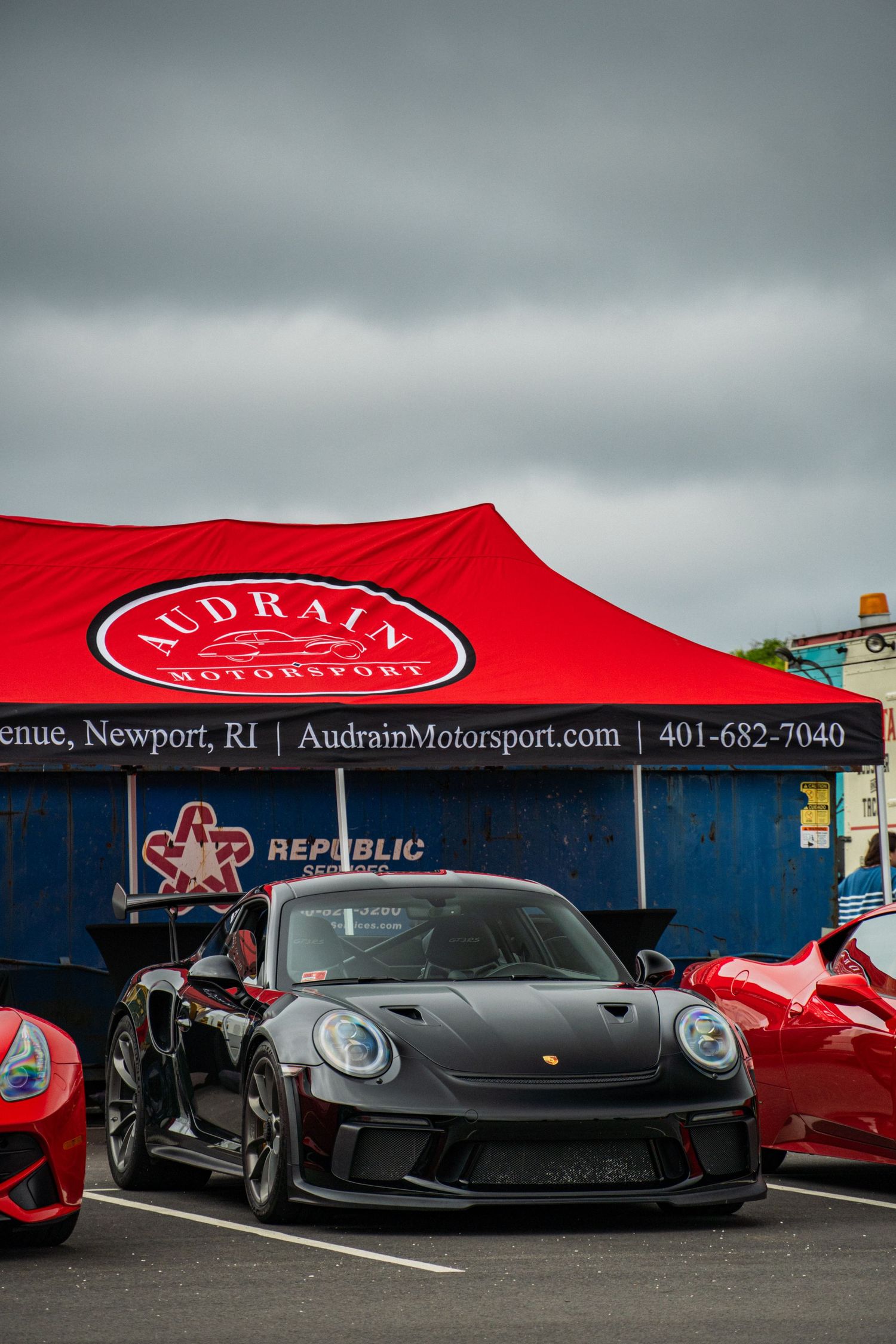 Porsche parked at cars and coffee for Audrain in Newport, RI