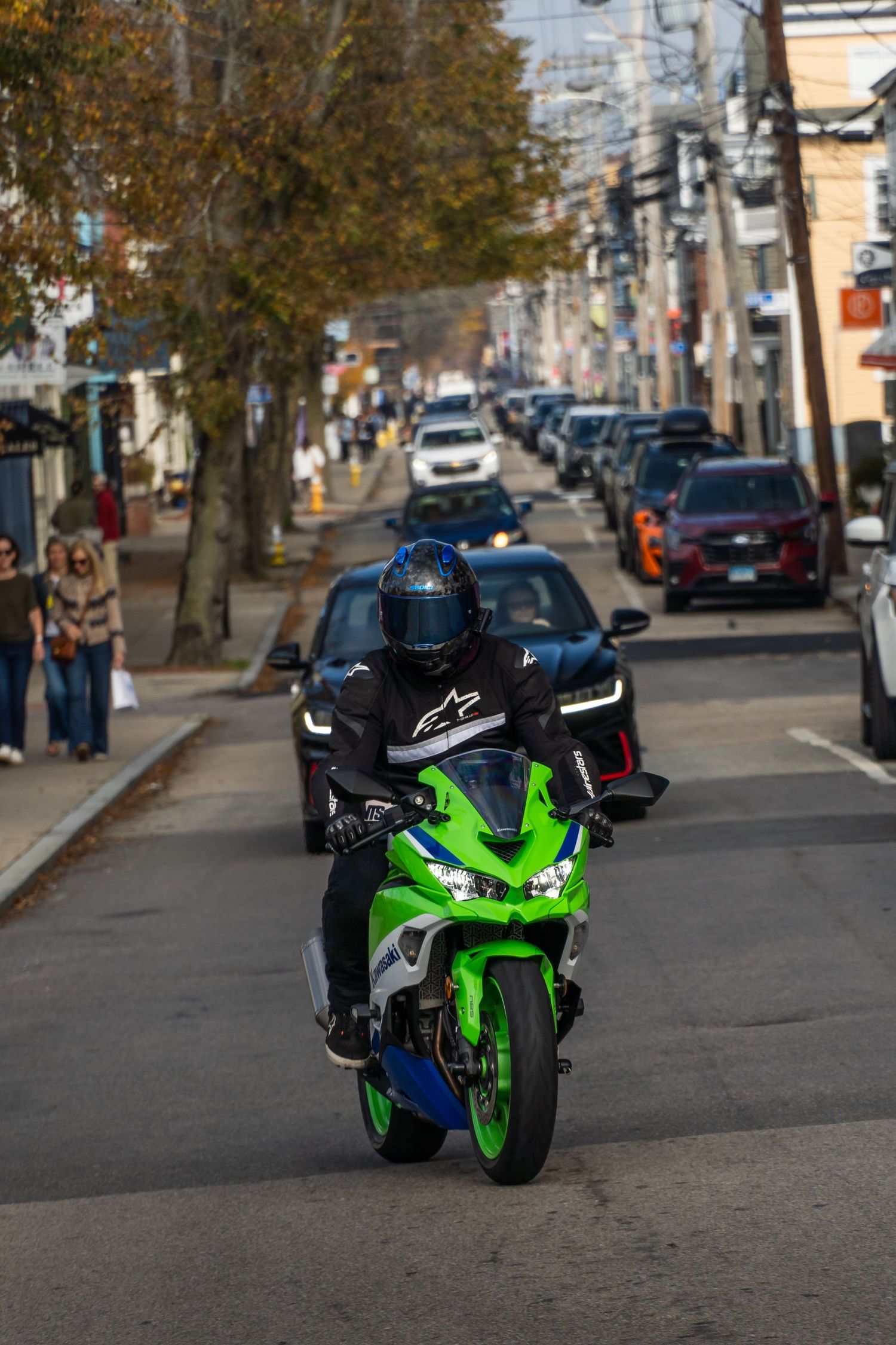 Anniversary edition Kawasaki ZX4RR cruising down the road