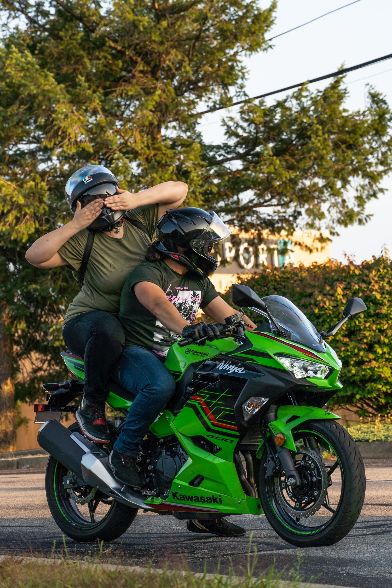 Green Kawasaki Ninja 400 with backpack