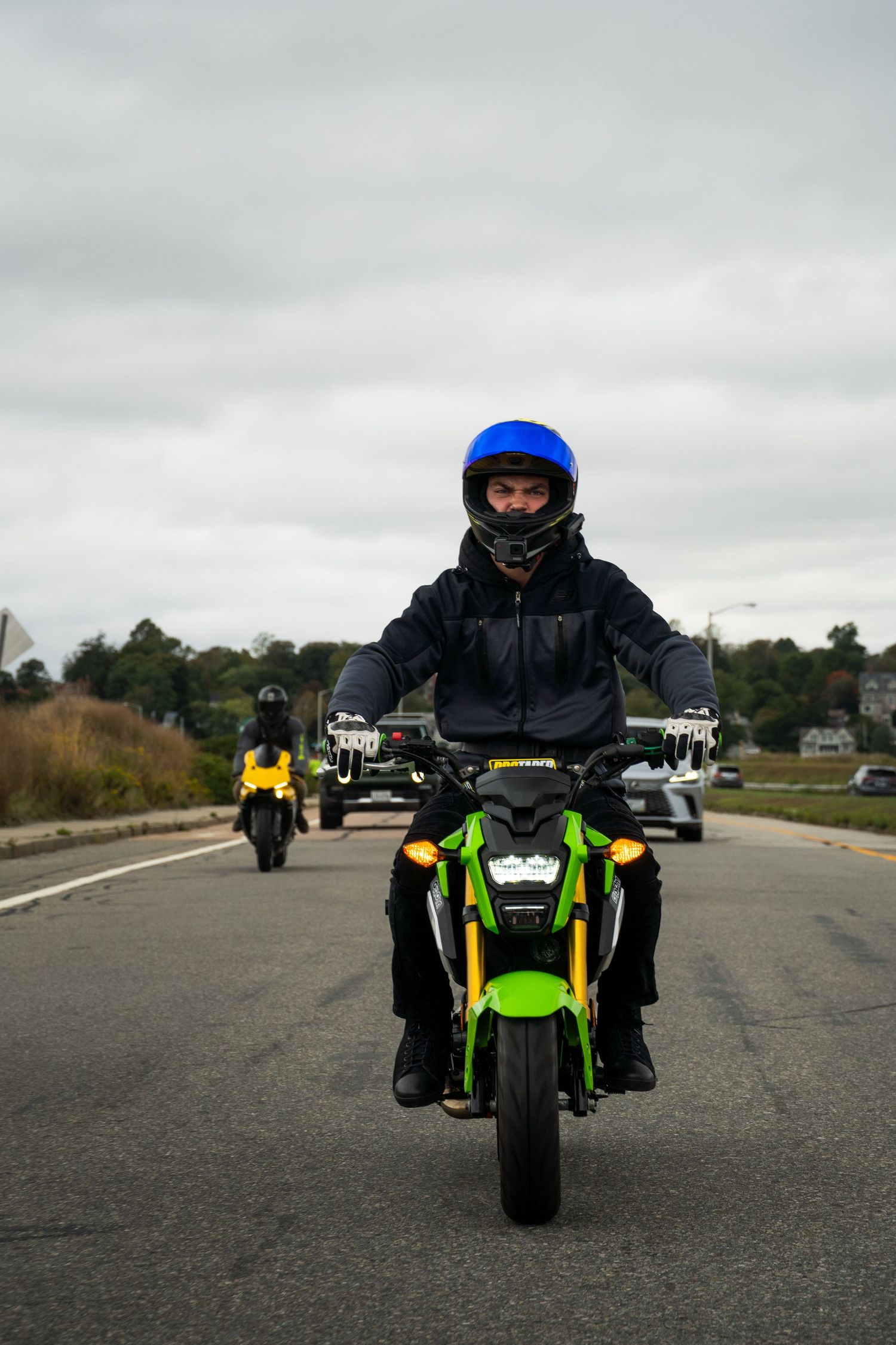 Honda grom cruising with friends