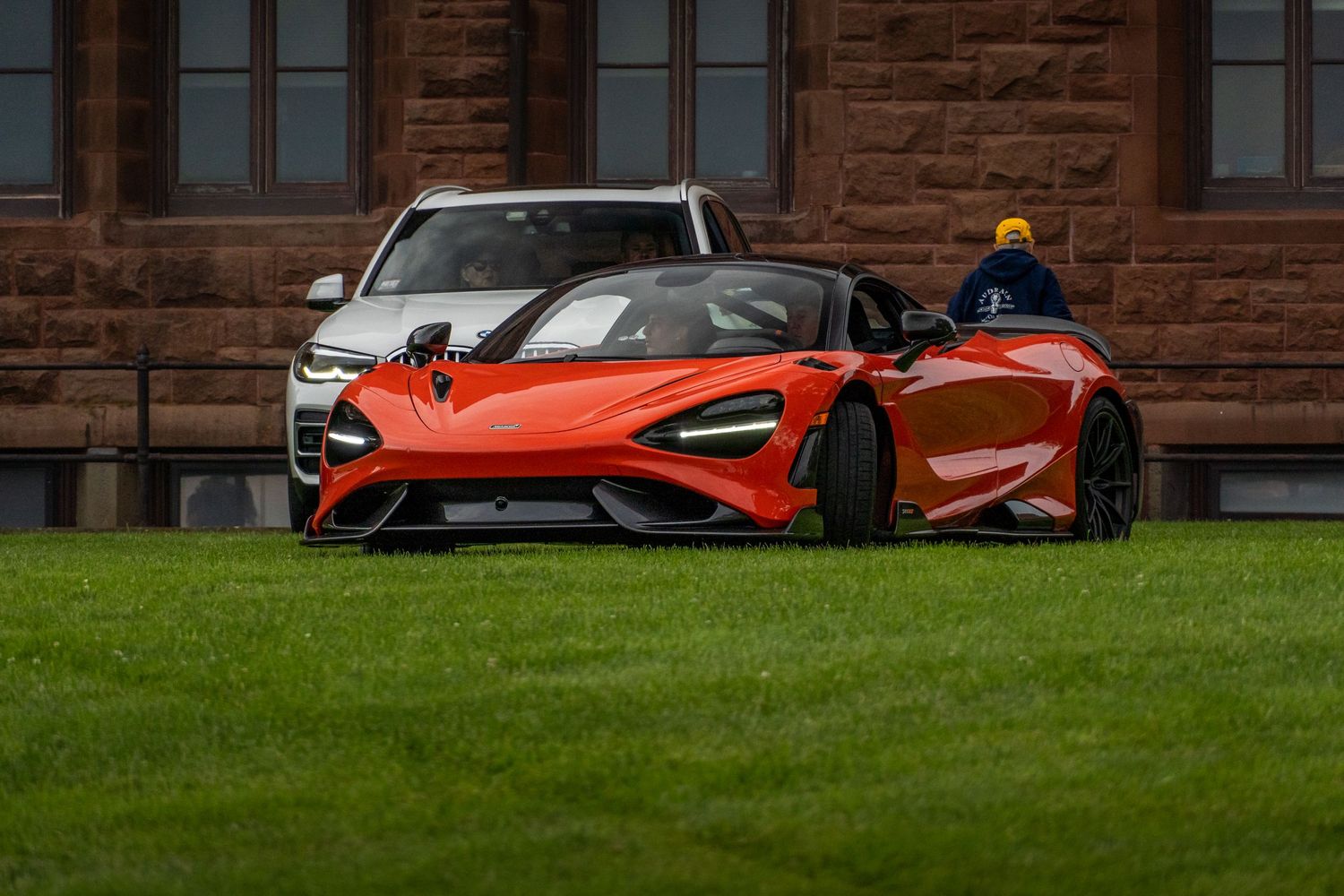 Mclaren parked on grass at a college