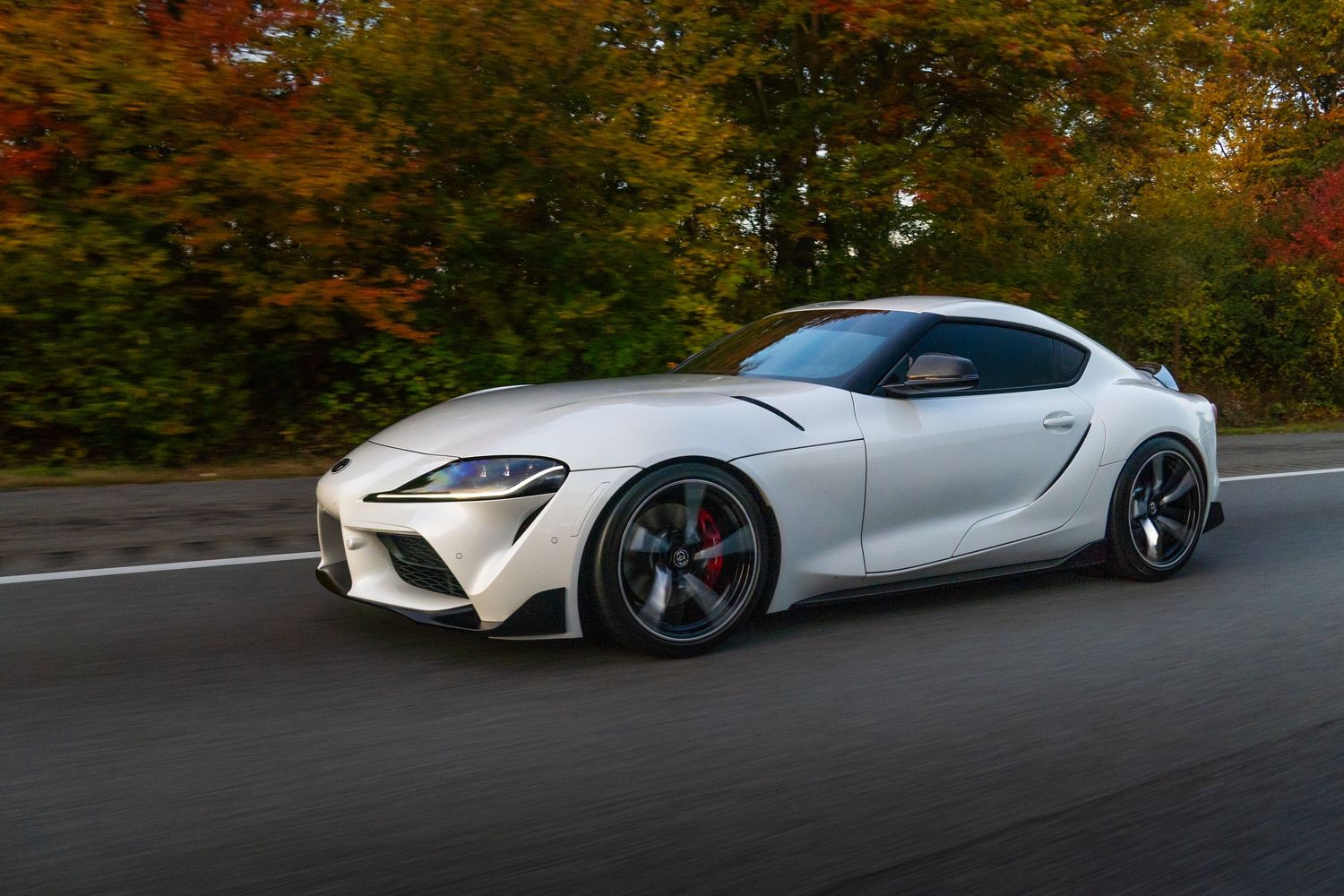 White Toyota Supra GR Rolling photo in the fall