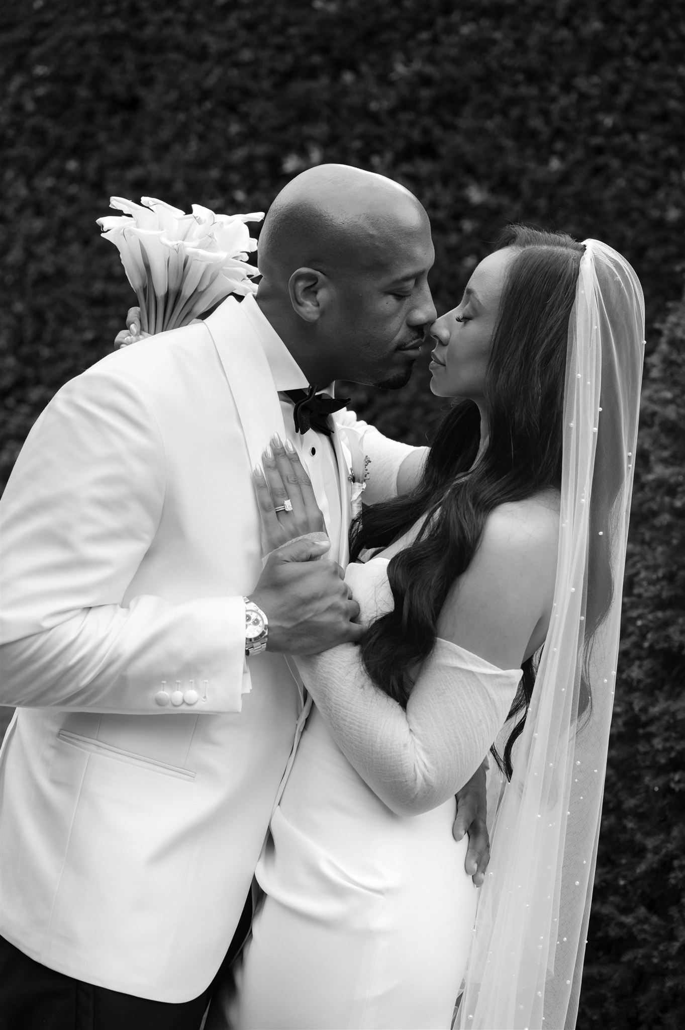 Black and white romantic wedding portraits capture intimate moments between newlyweds.