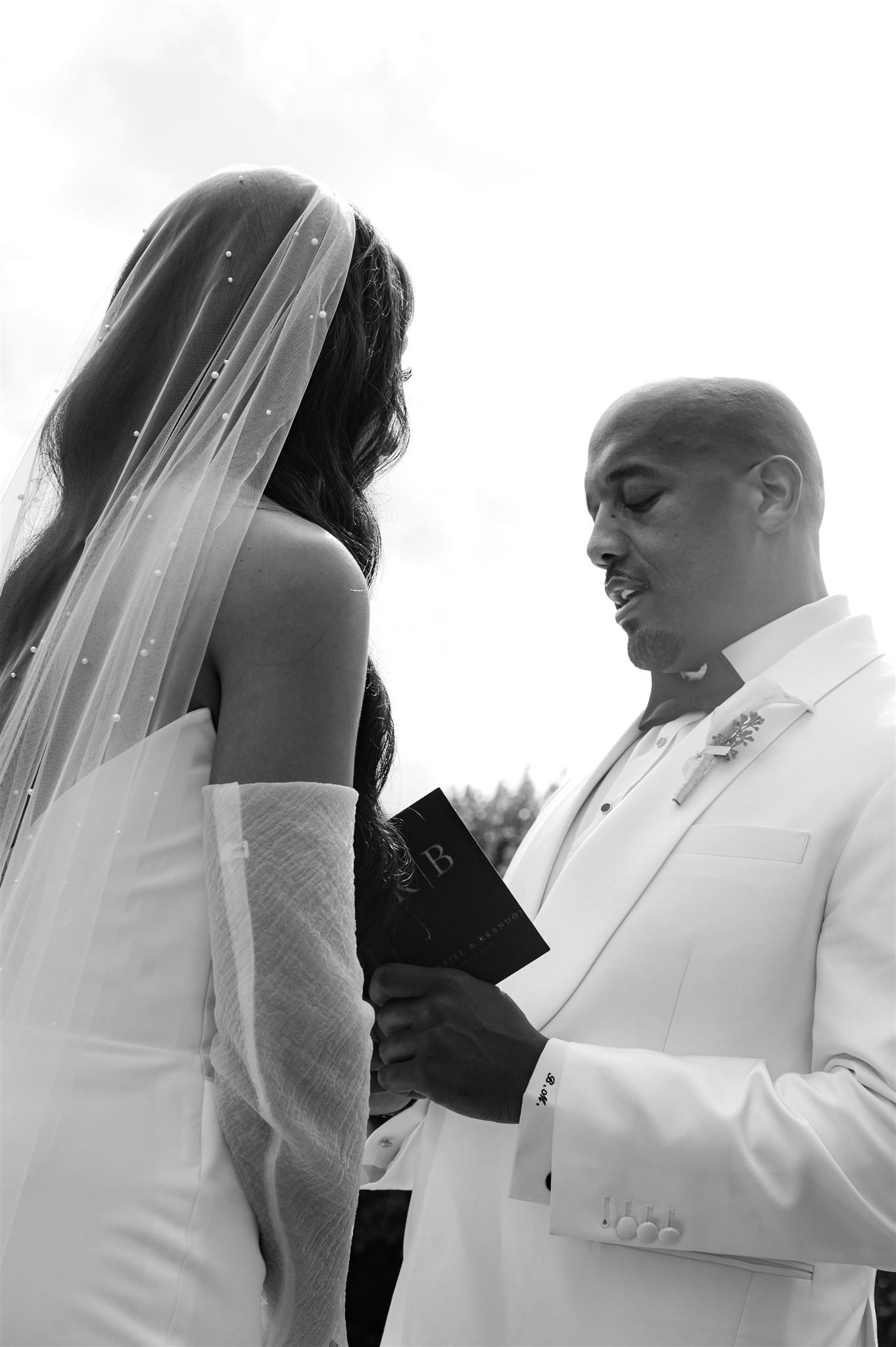 Black and white series of intimate wedding moments captured during an outdoor ceremony.