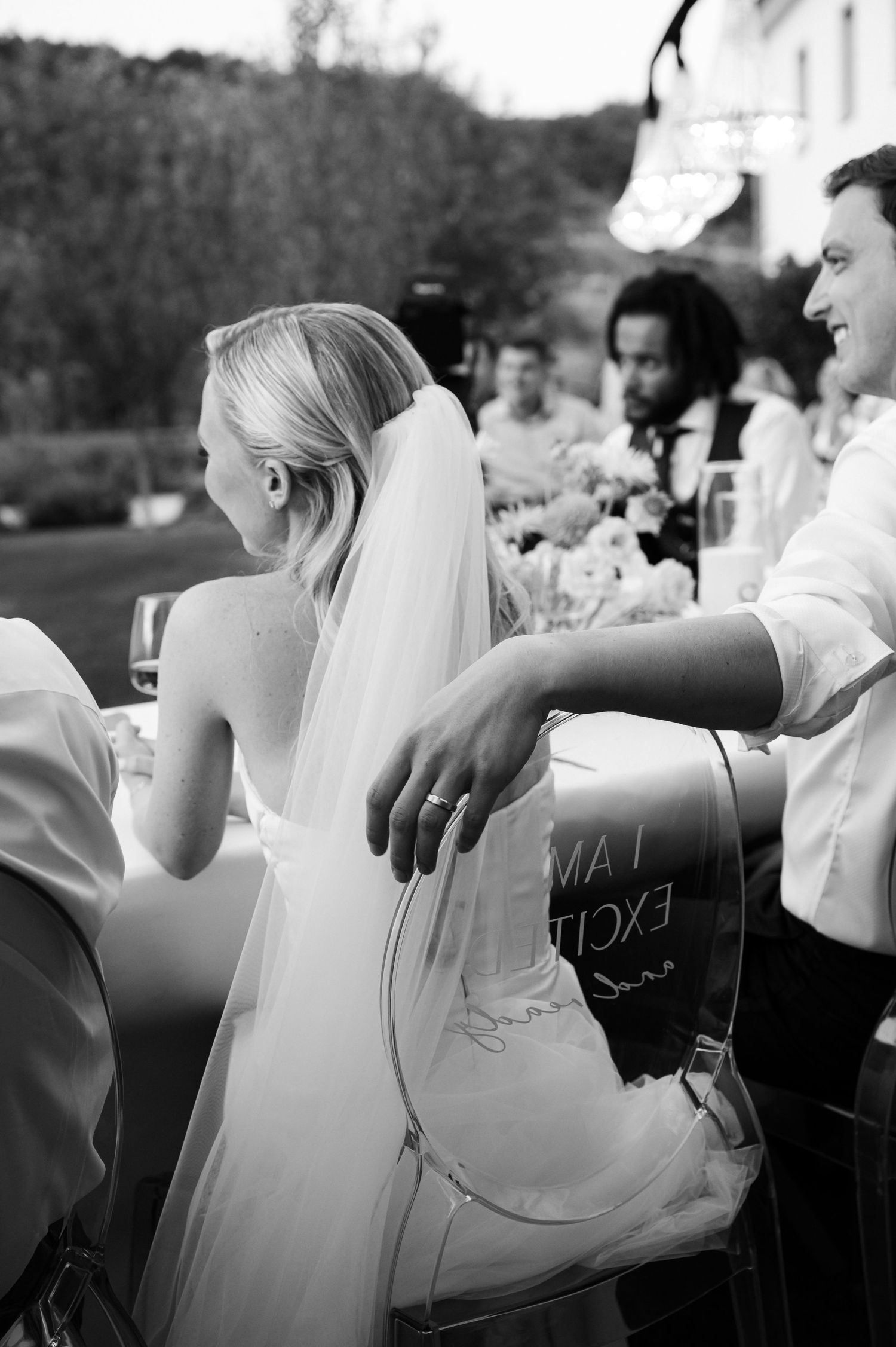 Black and white wedding photography showing candid moments during the reception.
