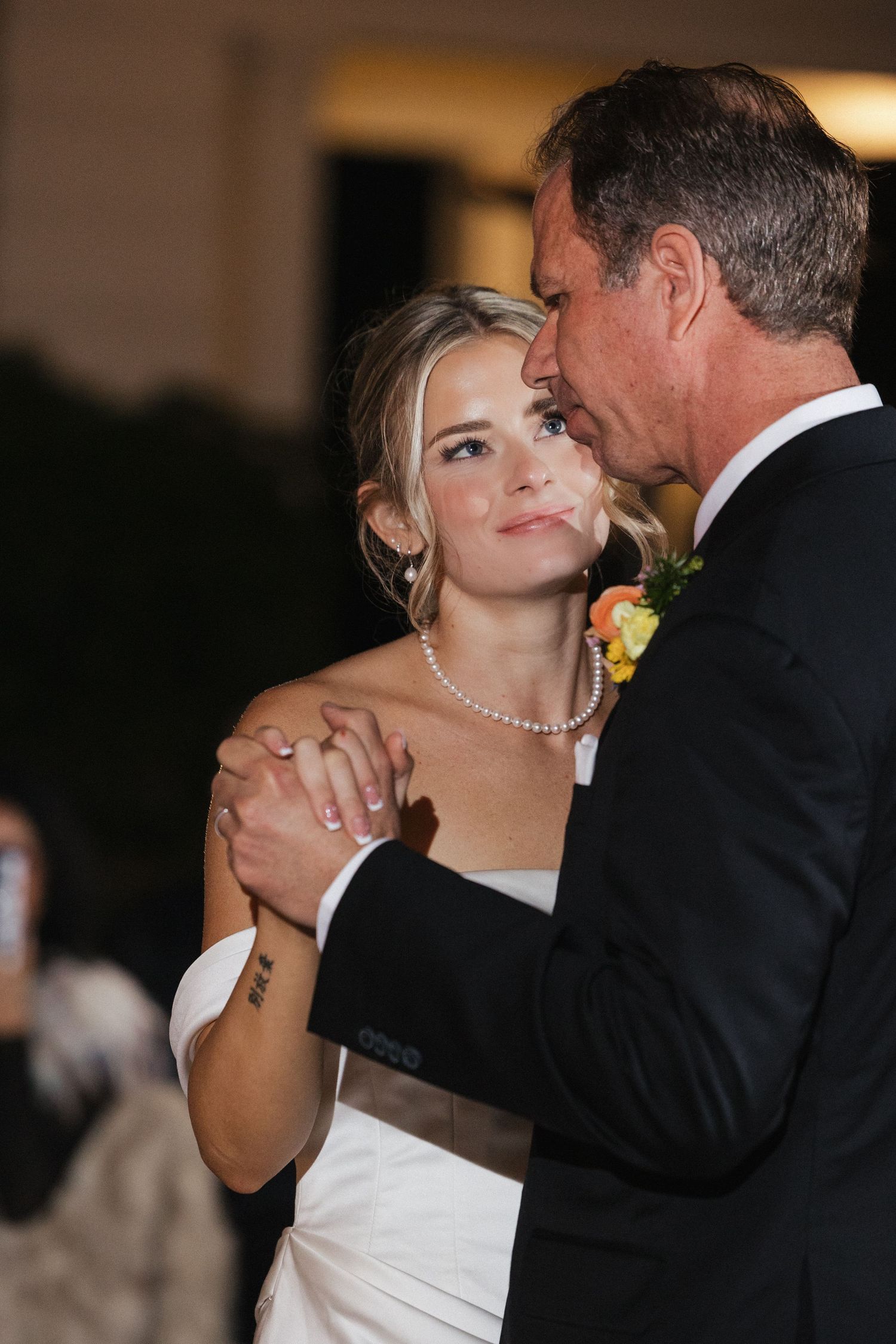Couple shares an intimate dance moment at their wedding reception.