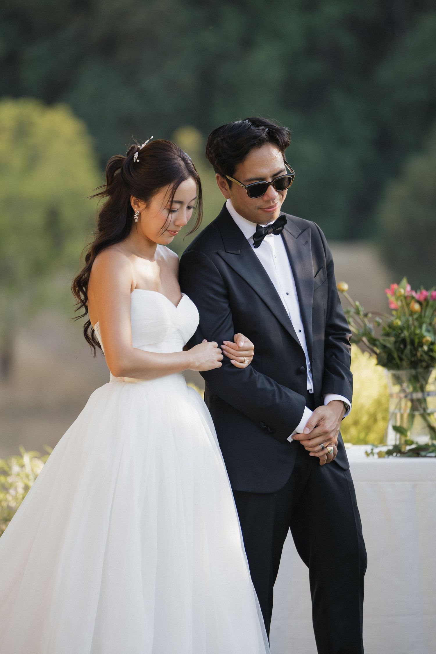 A couple shares intimate moments during their outdoor wedding photo session.