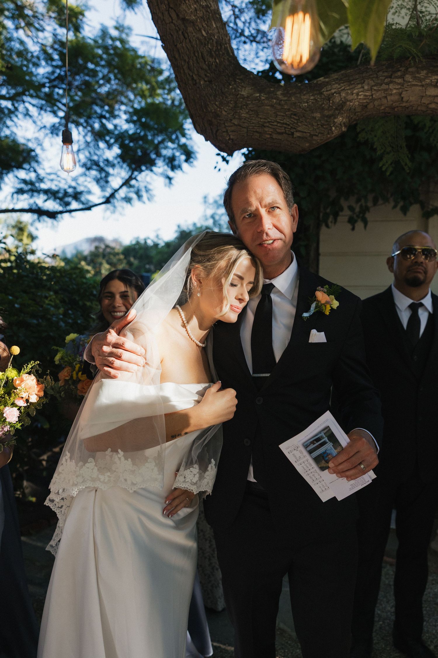 A romantic sequence of wedding photos showing tender moments between newlyweds under outdoor lighting at dusk.