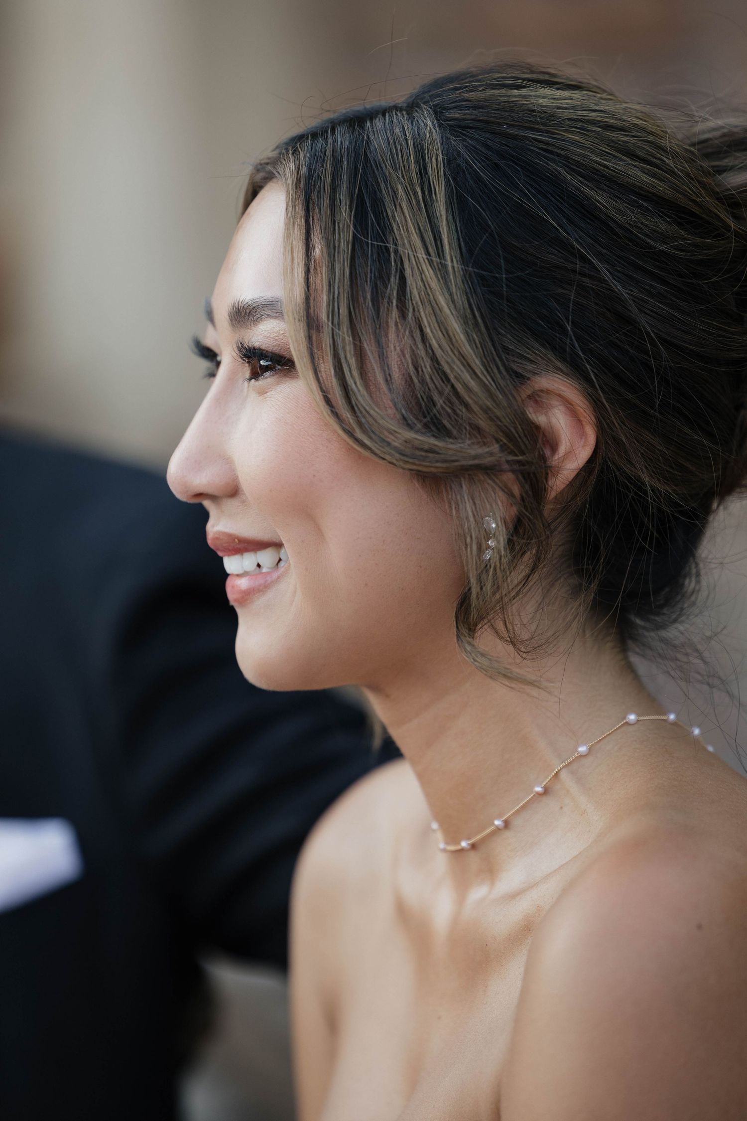 Elegant updo hairstyle with delicate jewelry showcased in a sequence of profile shots.