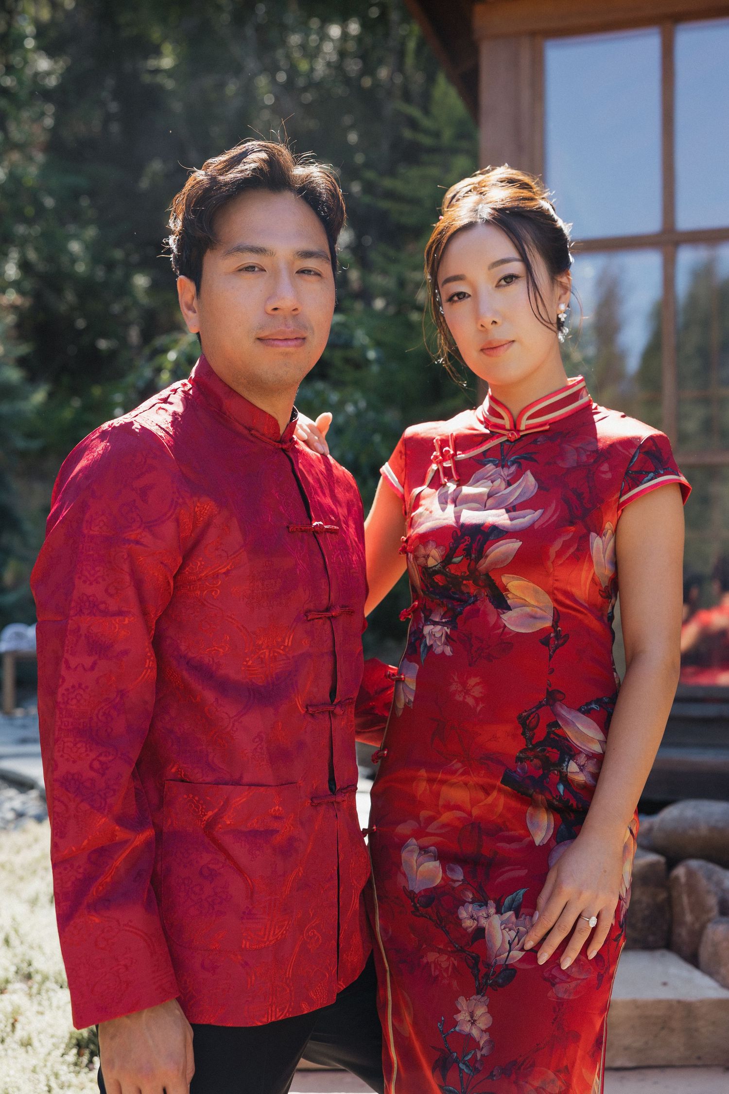 A series of photos showing a couple in traditional red Chinese qipao and matching attire posing together outdoors.