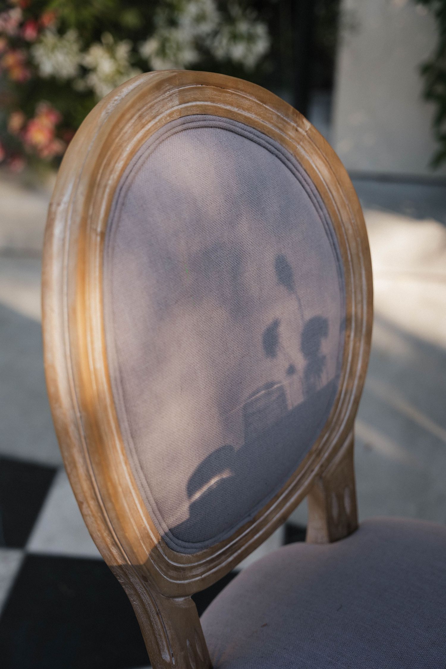 A sequence of close-up shots showing a vintage wooden chair back with curved details.