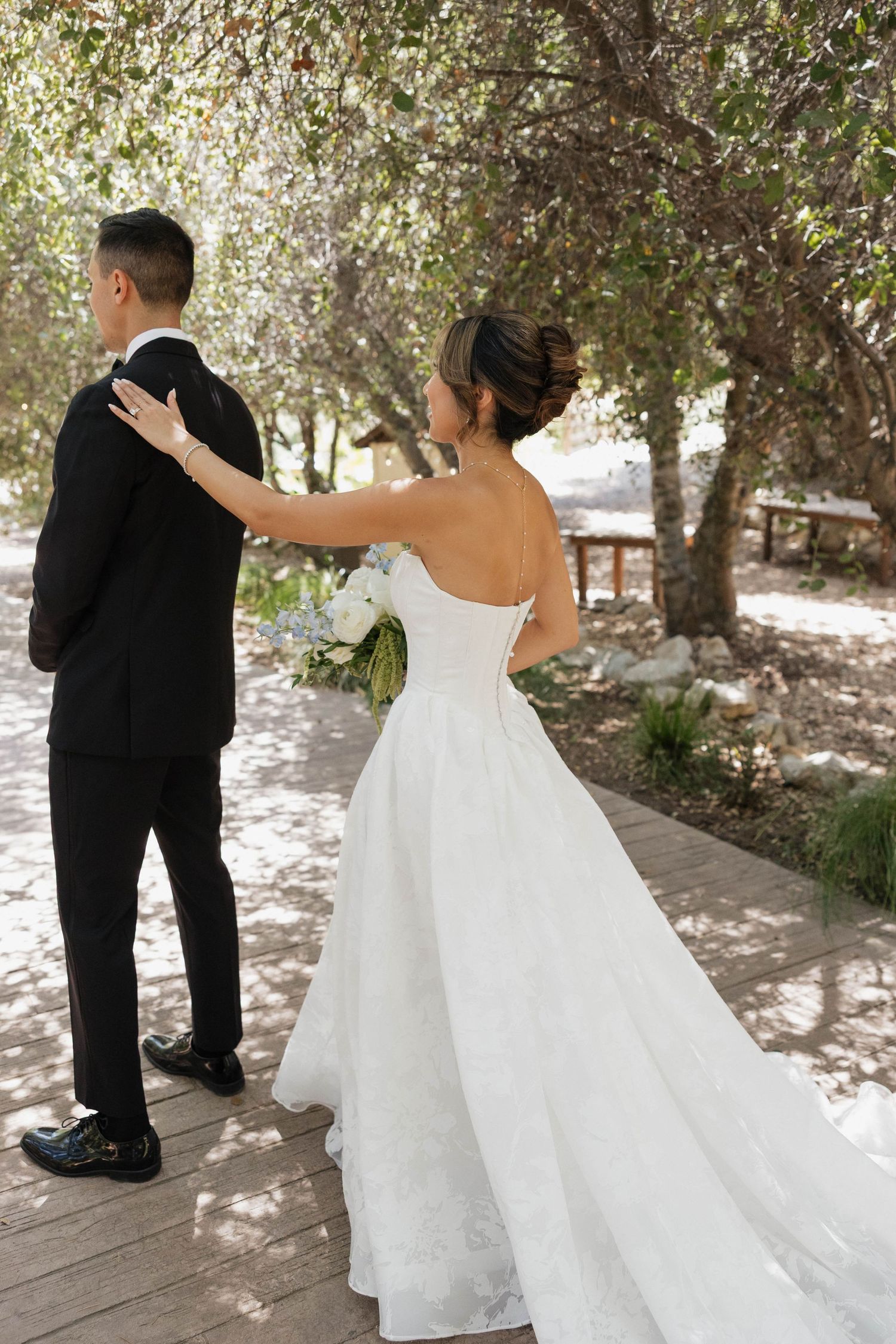 Series of artistic first look shots showing a bride surprising her partner on their wedding day.