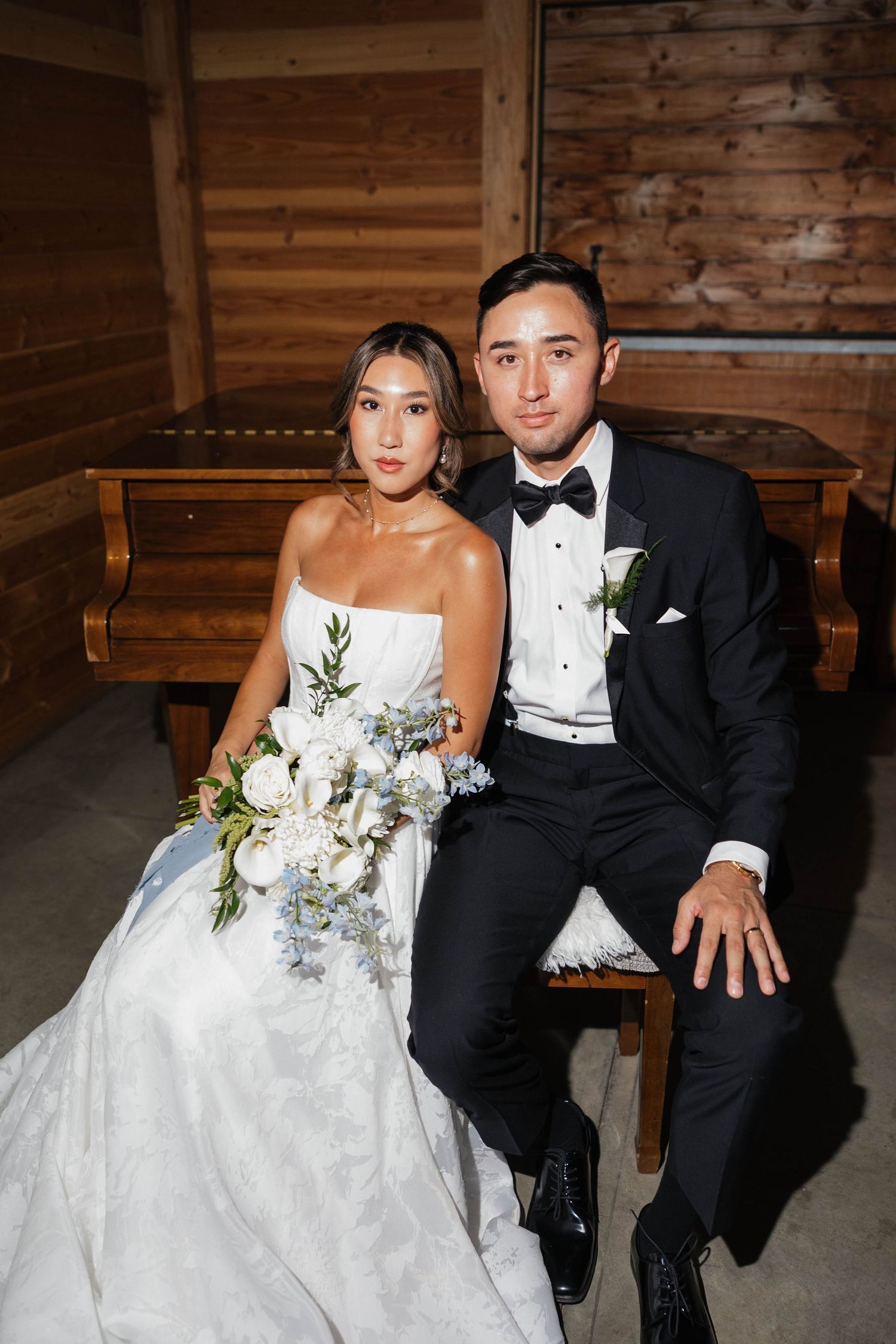 Rustic barn wedding portraits showing tender moments between newlyweds.