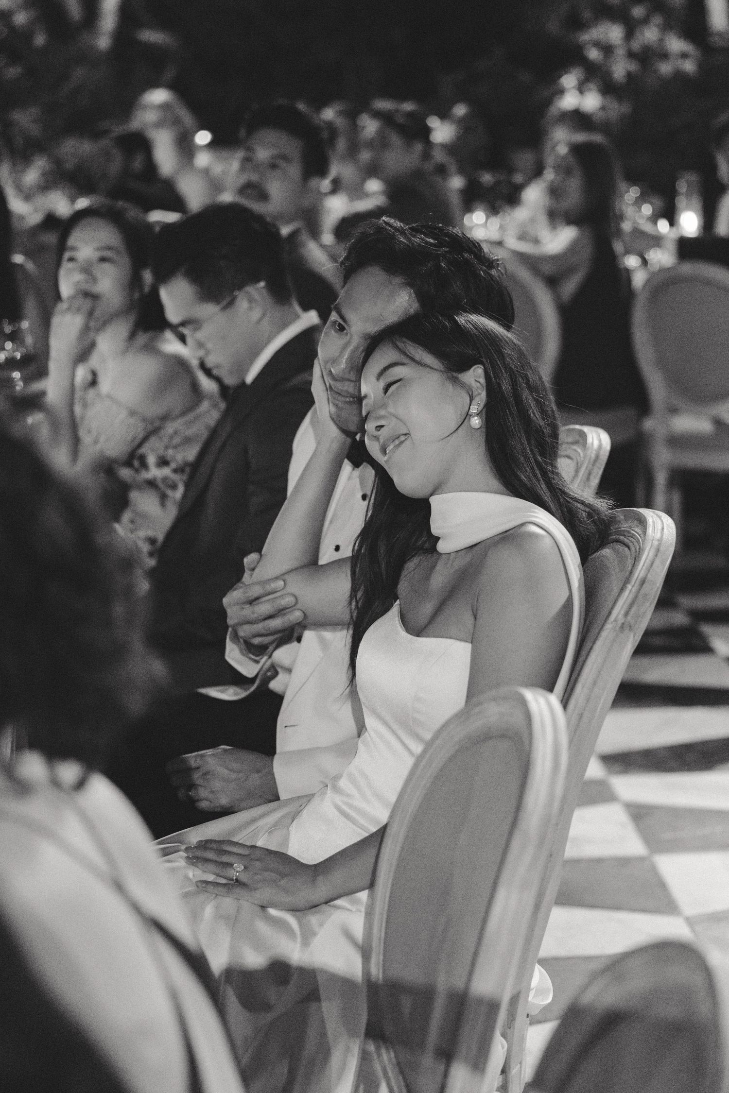 Black and white candid shots of wedding guests enjoying the outdoor ceremony.