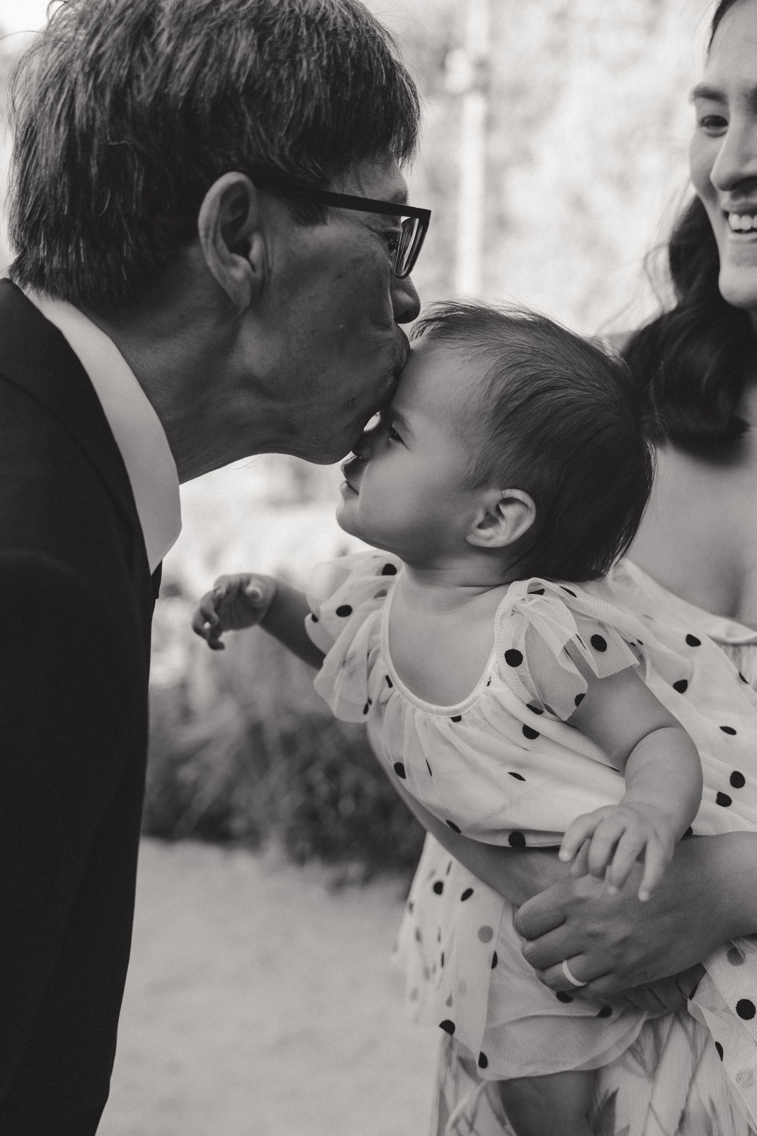 A tender moment between family members at a special celebration.